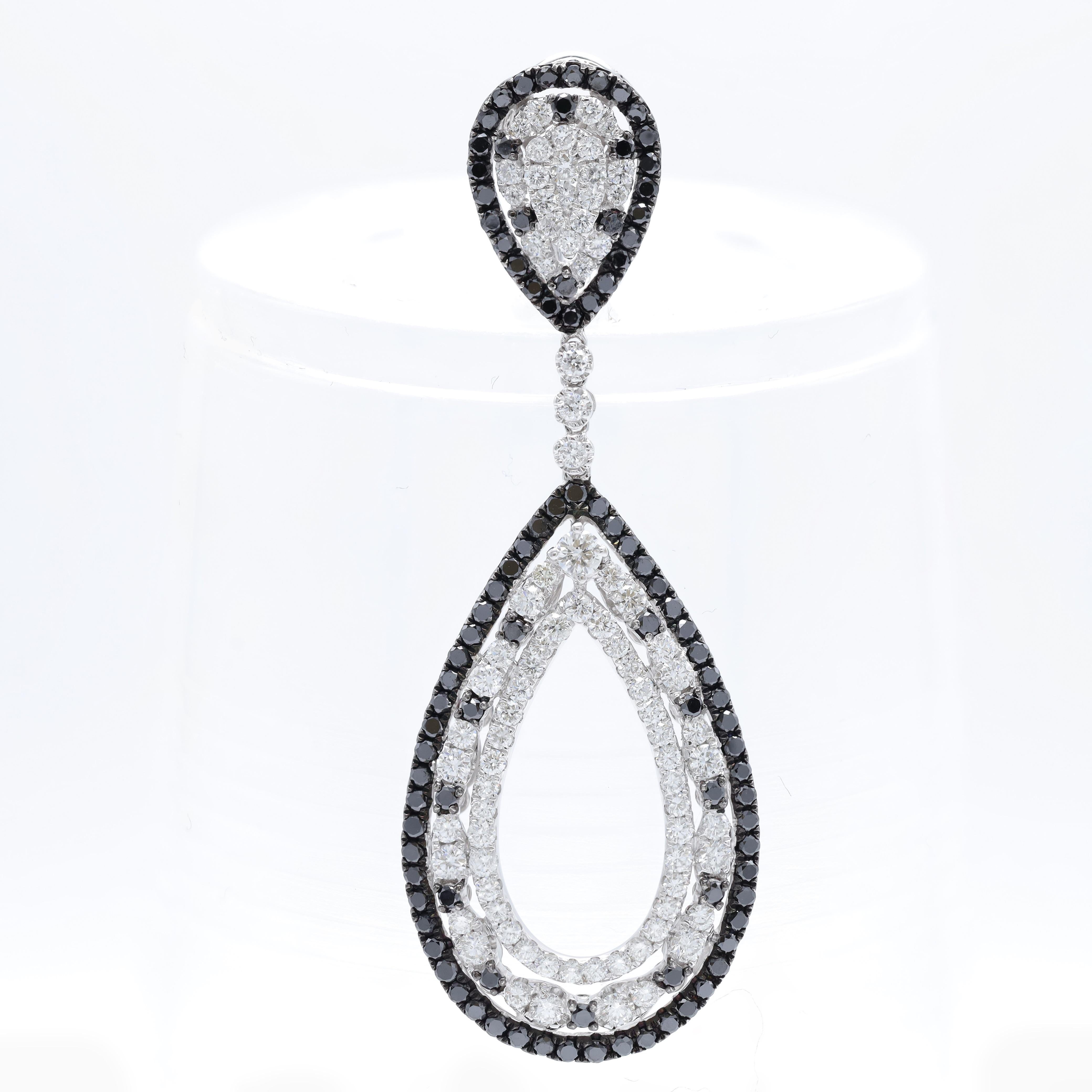 Modern Diana M.18 kt white gold diamond earring adorned with multiple drop shaped rings For Sale