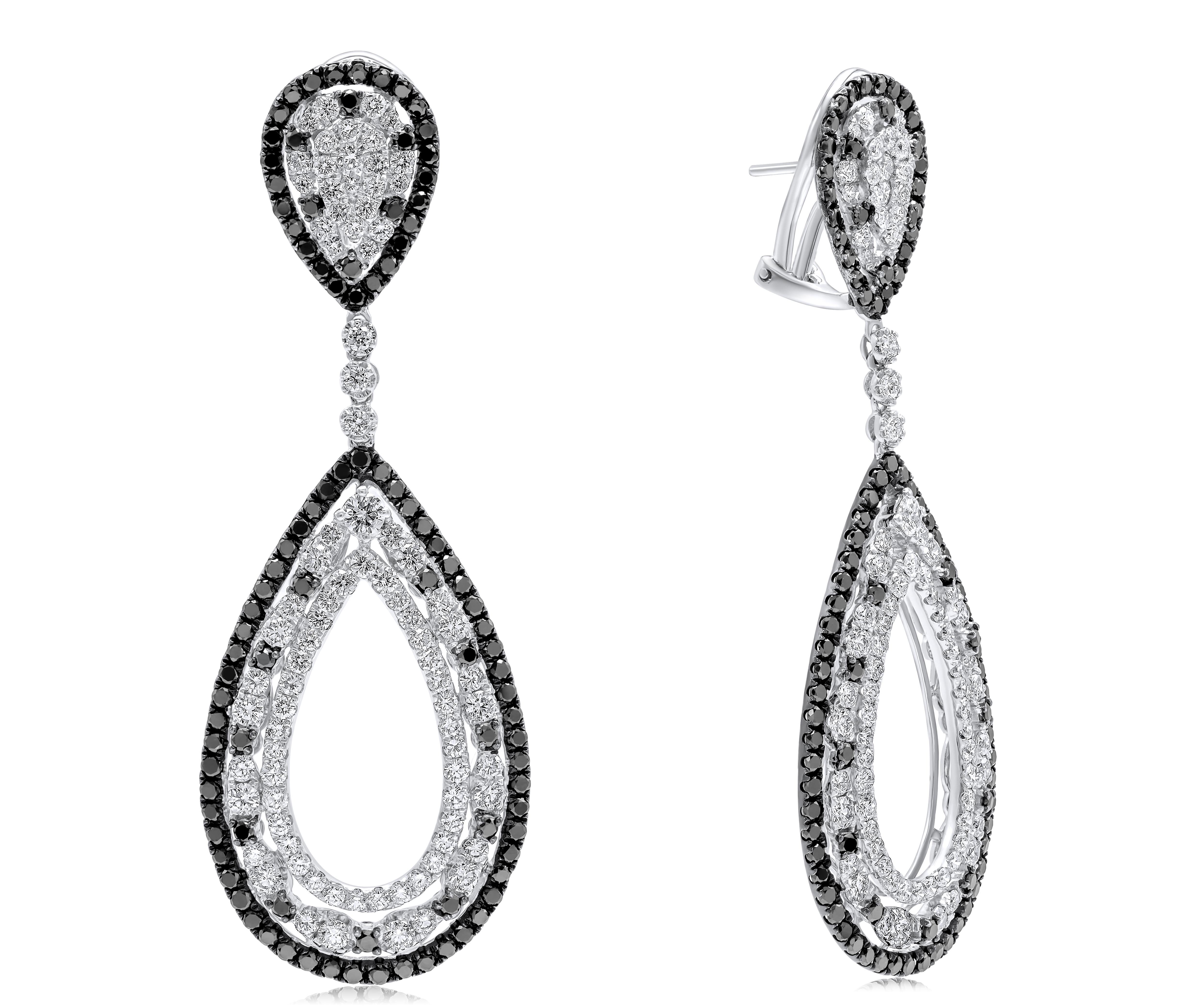 Round Cut Diana M.18 kt white gold diamond earring adorned with multiple drop shaped rings For Sale