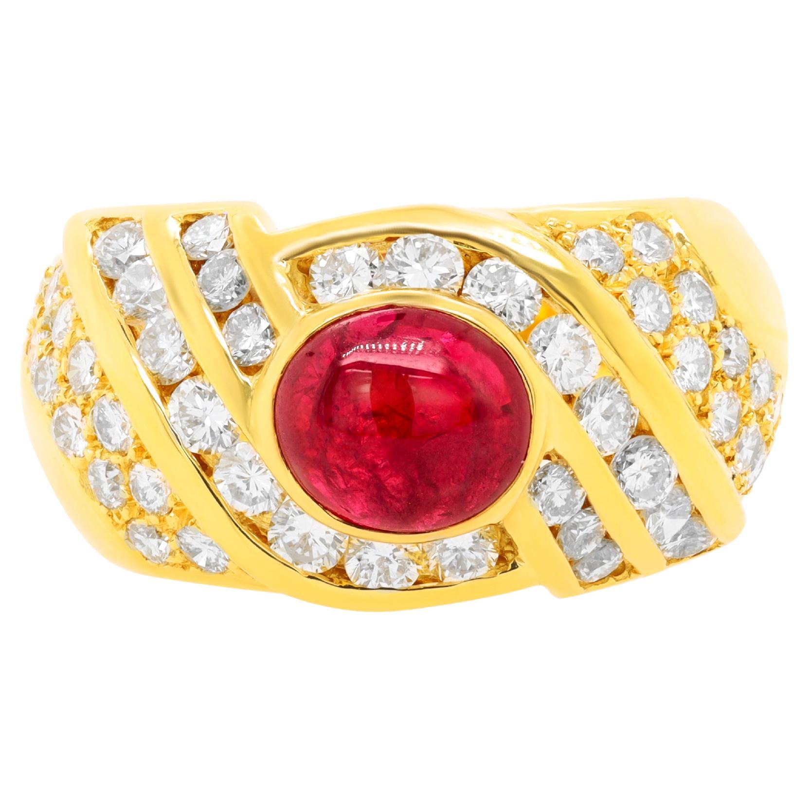 Diana M.18 kt yellow gold ruby and diamond fashion ring featuring a center 1.50 
