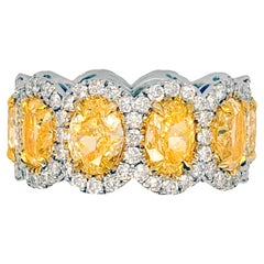 Diana M. 18KT TWO TONE GOLD YELLOW DIAMONDS WITH HALO OVAL BAND. 