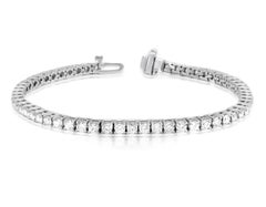 Diana M.18kt white gold tennis bracelet featuring 7.00 cts tw of round diamonds