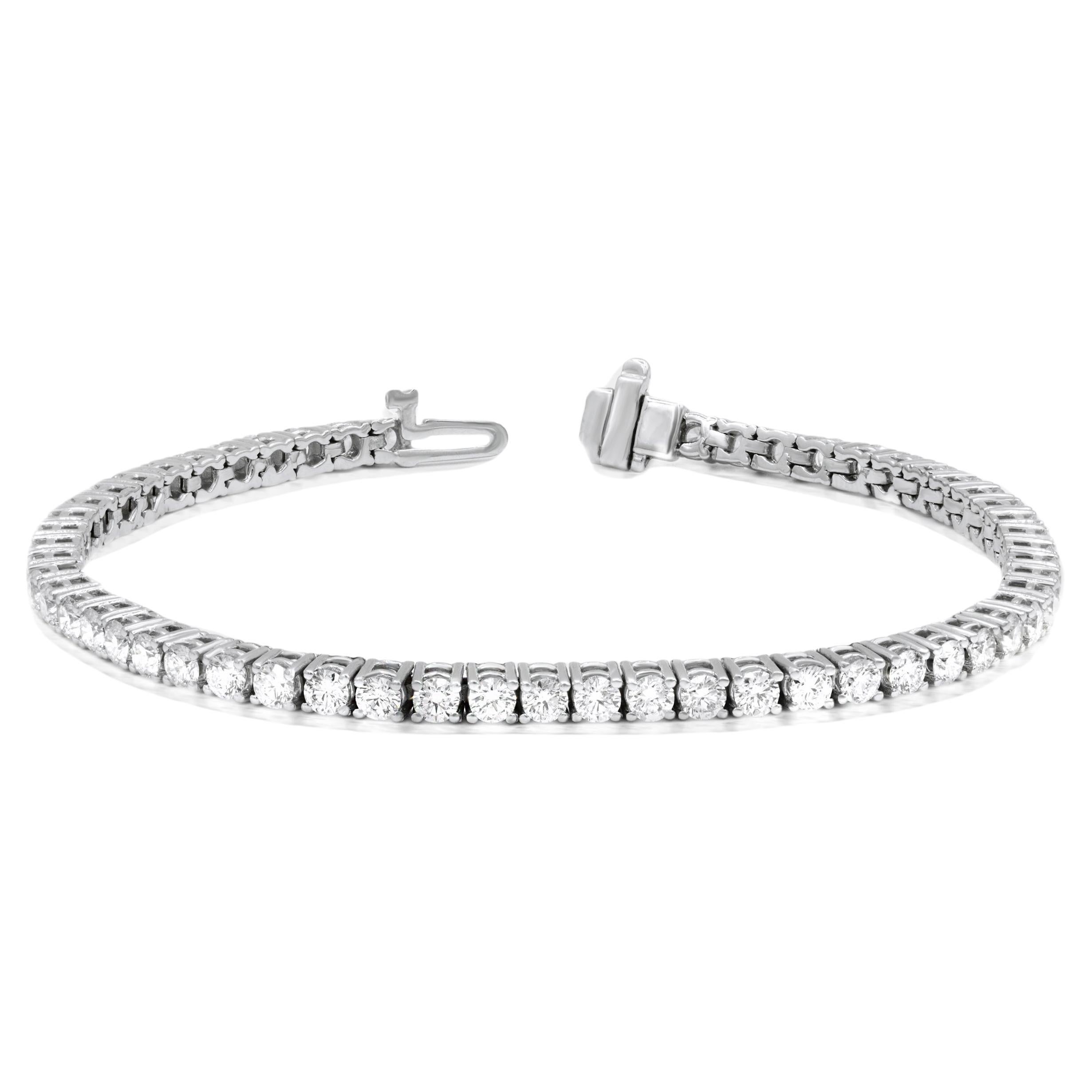 Diana M.18kt white gold tennis bracelet featuring 7.00 cts tw of round diamonds  For Sale