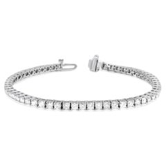 Diana M.18kt white gold tennis bracelet featuring 7.00 cts tw of round diamonds 