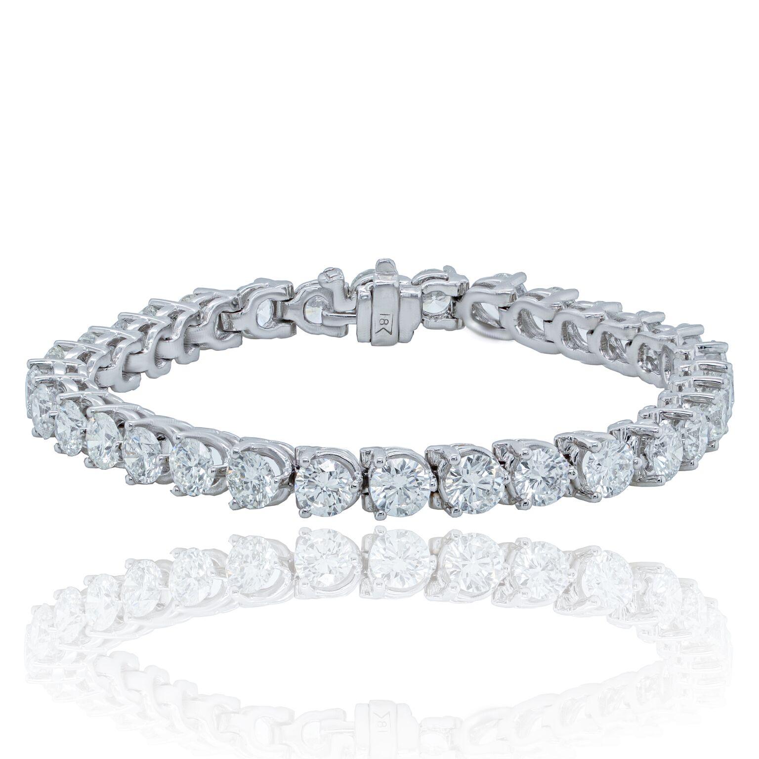 Custom 18kt white gold tennis bracelet with 7.85 cts of round diamonds in a 3 prong setting  36 stones 0.22 each ston GH color SI clarity.  Excellent Cut.
