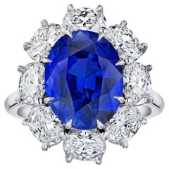 Platinring "Diana" Ovaler Halo mit sechs Karat blauem ovalem Saphir