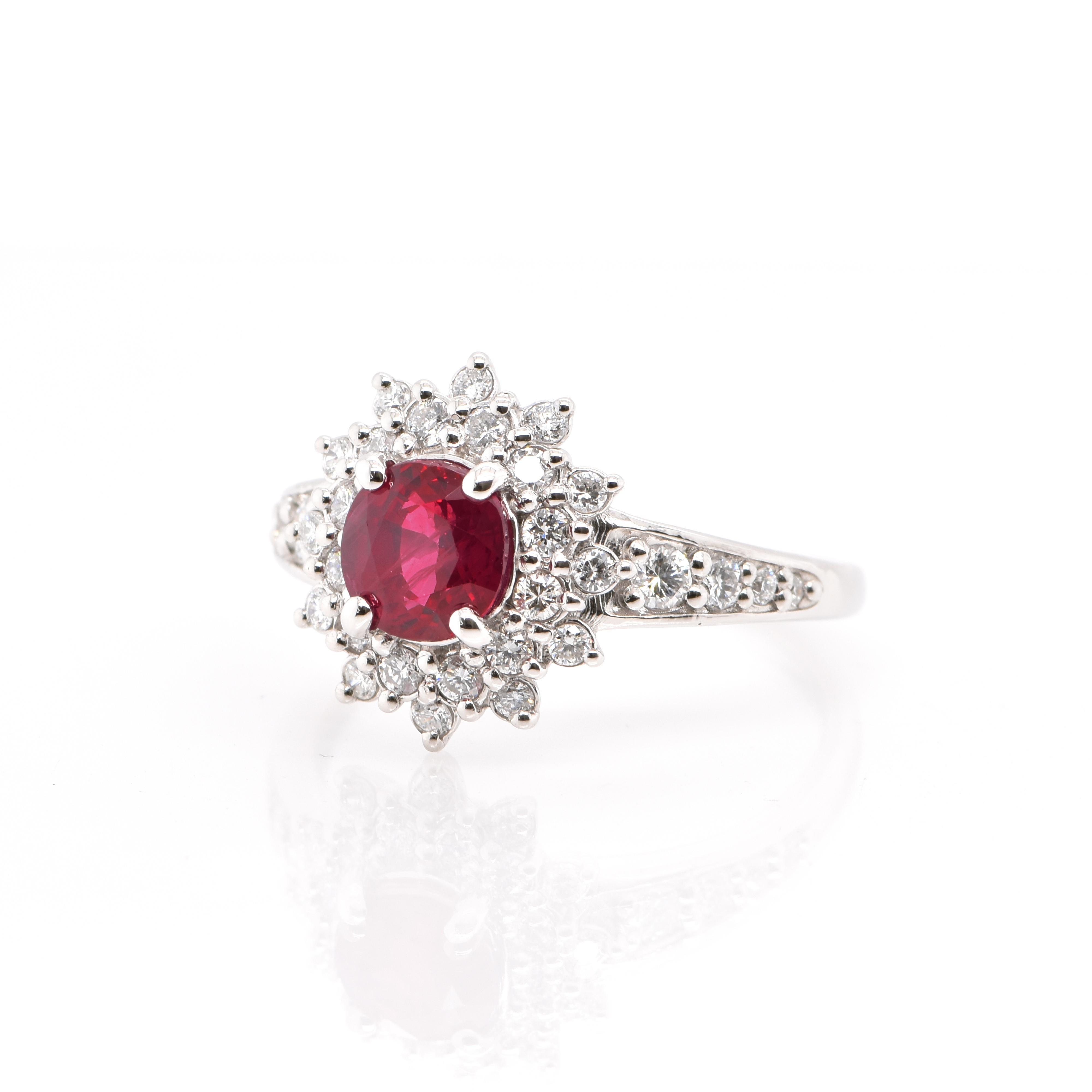 A beautiful Princess Diana Style Halo Ring featuring a 1.24 Carat, Natural, Round-Cut Ruby and 0.50 Carats of Round Brilliant Diamonds set in Platinum. Rubies are referred to as 