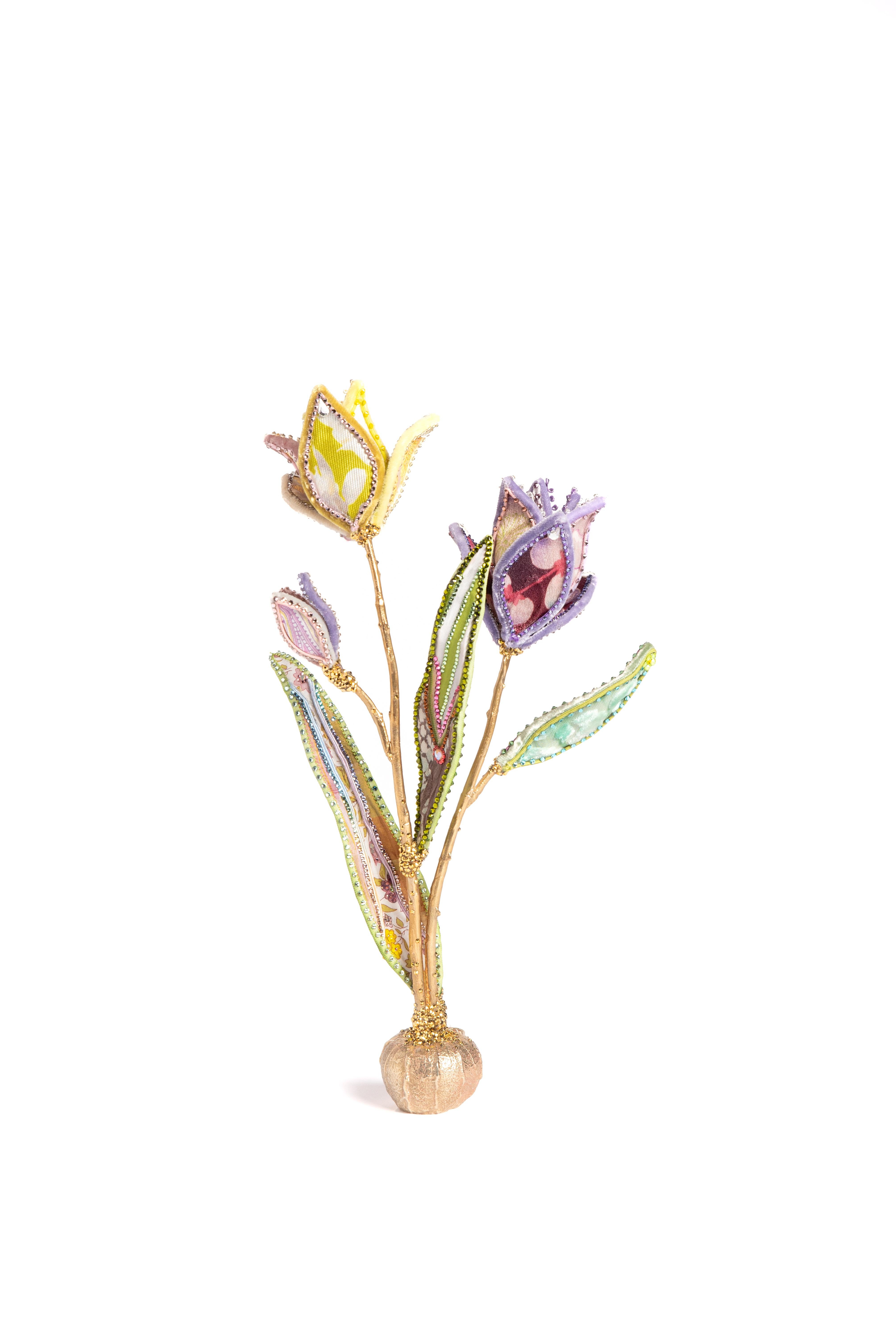 Purple & Yellow Tulip in silk and velvet resting upon a bulb-shaped brass base. Exceptionally detailed leaves feature one-of-a-kind designs on each piece. Adorned with vintage millinery embellishments, European crystals, and vintage faux-stamen.