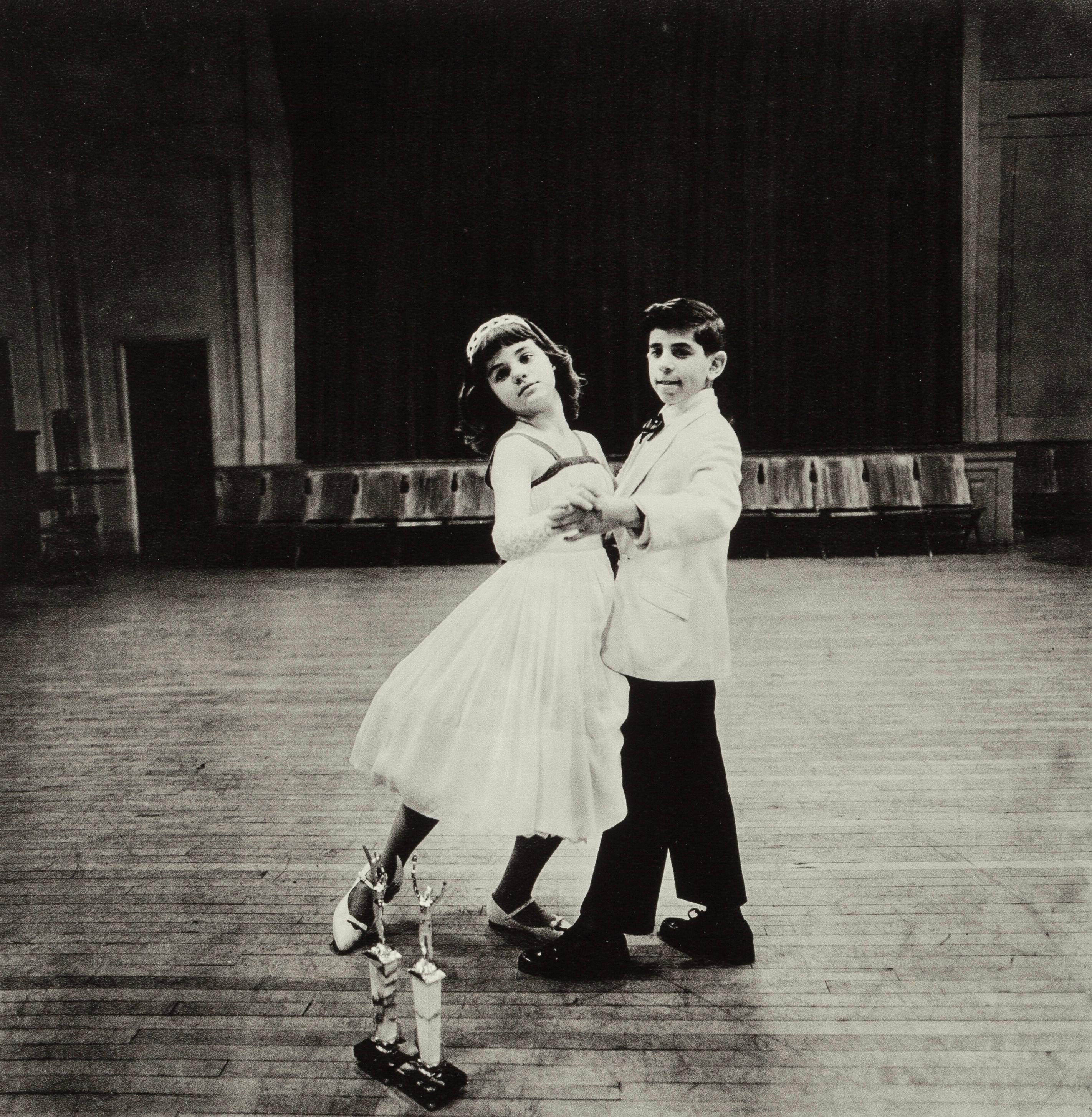 This exquisite heliogravure after Diane Arbus (1923–1971), titled The Junior Interstate Ballroom Dance Champions, Yonkers, N.Y., originates from the 1979 folio Diane Arbus, Electa Editrice Portfolios. Published by the United Nations Educational,