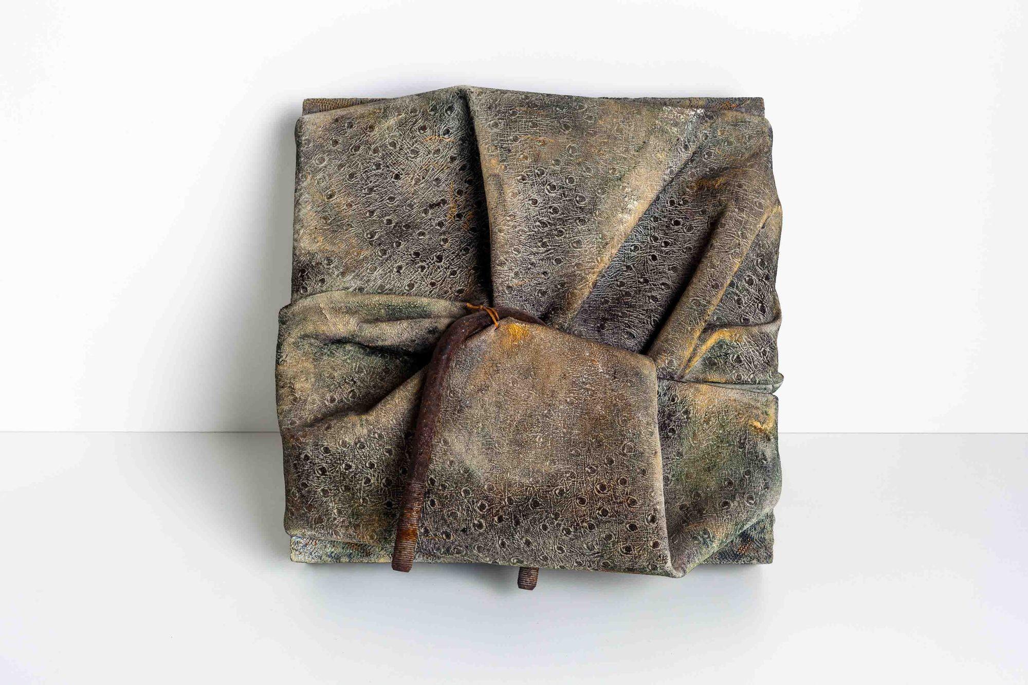 Diane Cooper Mixed Media over Wood Wall Mounted Bundle Sculpture, From Ruth Horwich collection.
Textures Canvas and Metal
About Diane Cooper:
Inspired by the visual culture in Japan, Diane Cooper’s subtle use of materials makes use of aged and worn