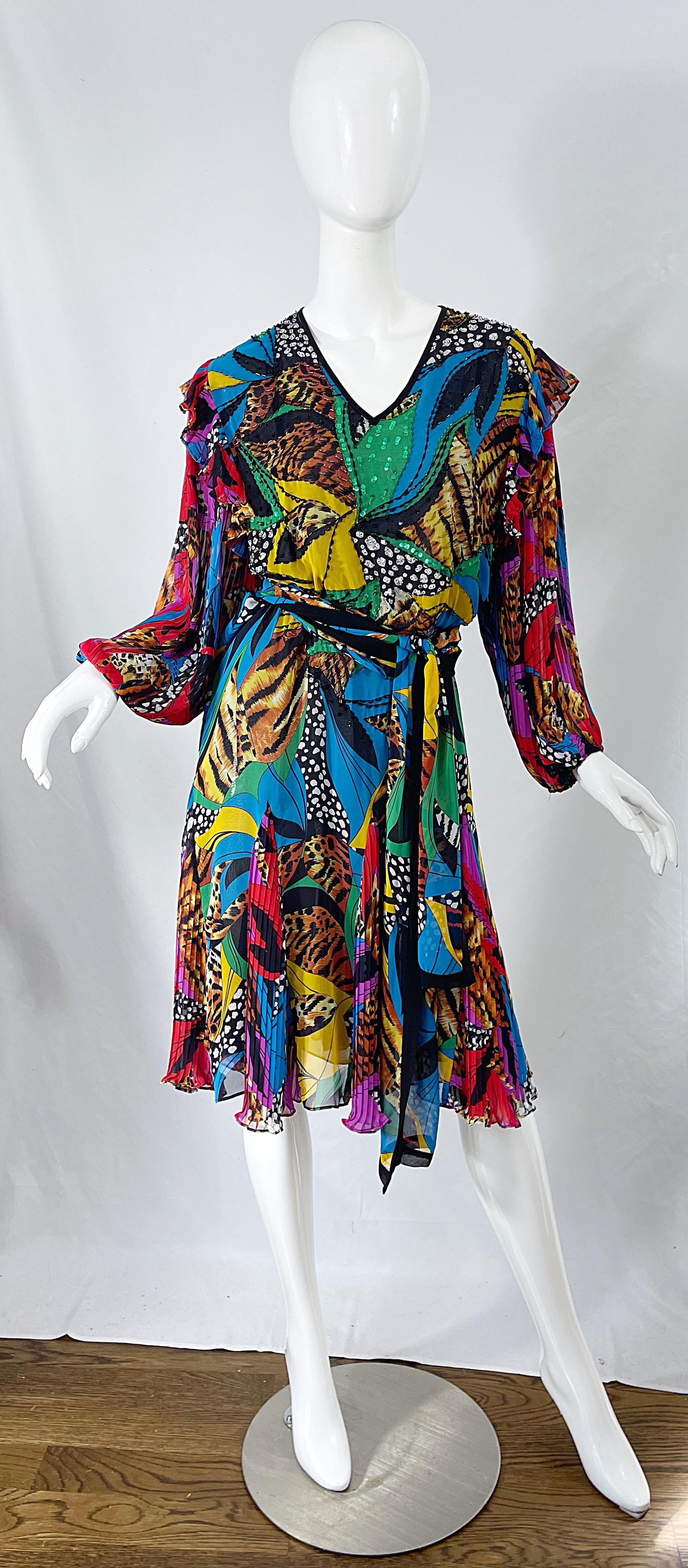 Fabulous mid 1980s DIANE FREIS beaded and sequin abstract and animal print chiffon dress ! Features a blouson style bodice with vibrant colors of green, blue, purple, black, white, yellow, red, and tan. Ruffle details at each shoulder. Simply slips