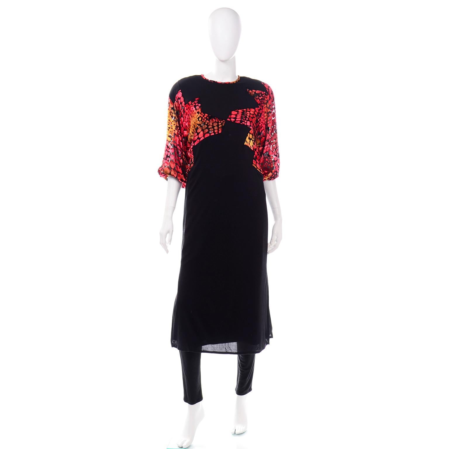 We absolutely love Diane Freis vintage pieces and this one is so unique! This vintage Diane Freis 2 piece evening ensemble is in a black silk jersey with velvet burnout accents in shades of red orange and yellow. The tunic style dress has black silk