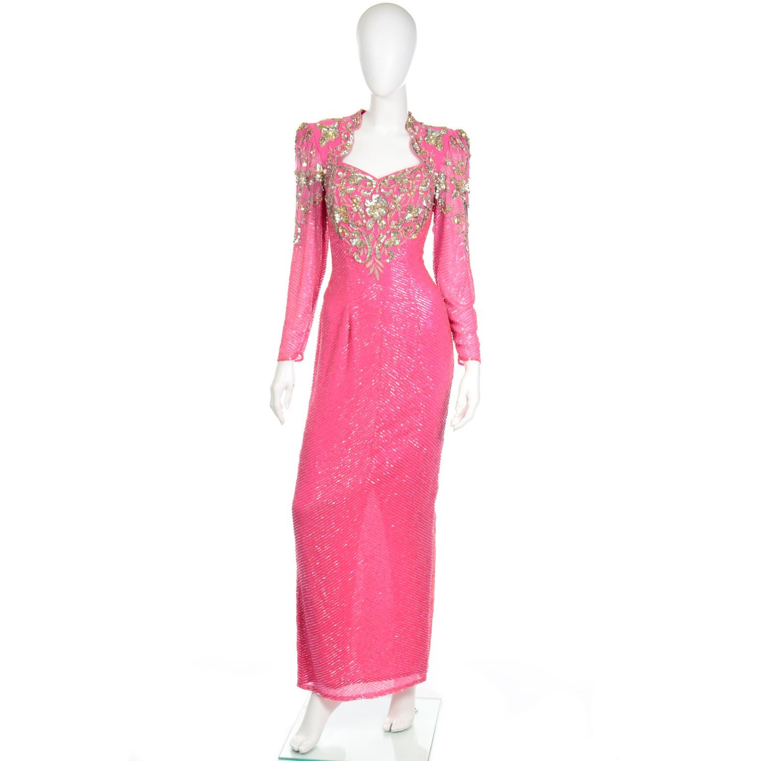 This dramatic vintage beaded pink evening gown was designed by Diane Freis in the 1980's.This dress is truly stunning in person and shimmers in the light when it moves. The dress is covered with rows of bugle beads and the bodice and shoulders are