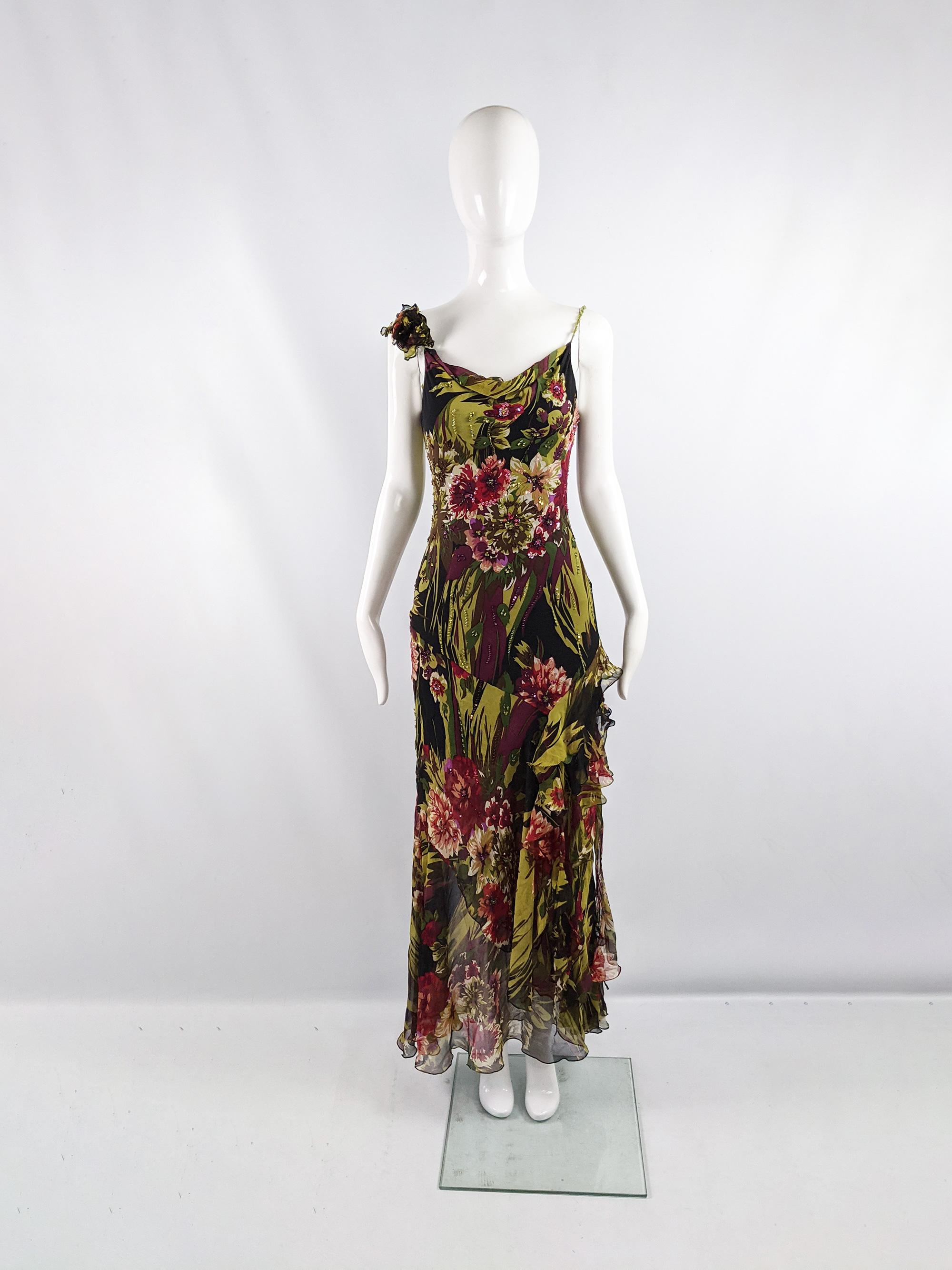 A sexy vintage womens Diane Freis maxi dress from the 90s. In a bias cut silk chiffon, hand beaded and embellished with sequins throughout the floral print. It has a strappy sleeveless design with attached flower detail on one strap, a matching