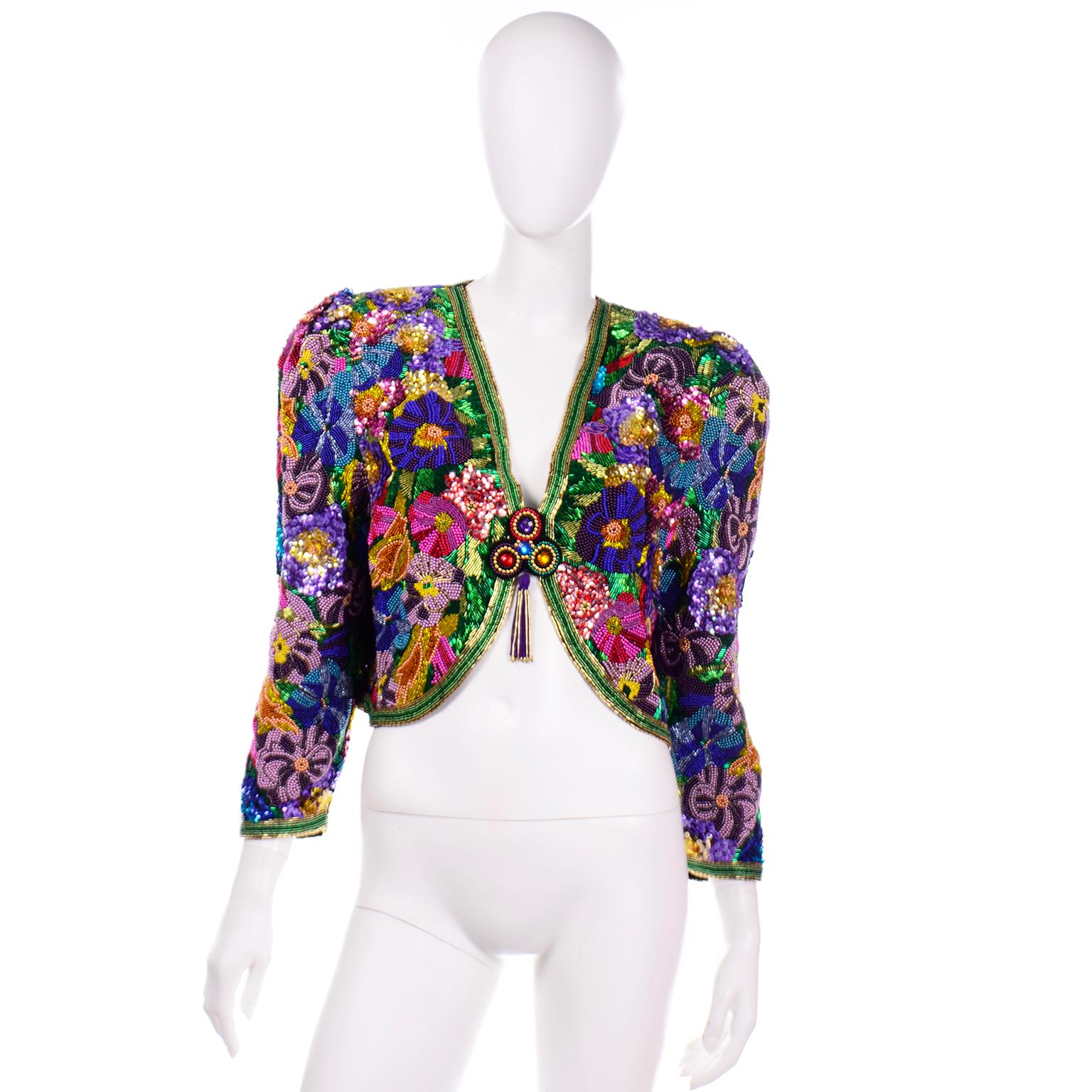 This is an absolutely stunning Diane Freis Petites silk hand beaded bolero style jacket. This is truly a special piece that will add so much to a simple dress, pair of trousers or an evening skirt! We acquired this jacket when we purchased an estate