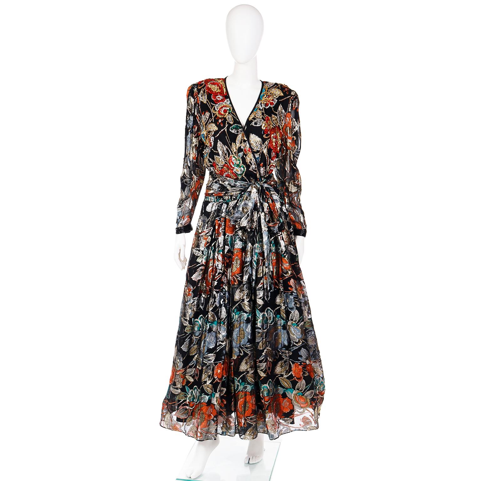 This is a stunning vintage Diane Freis vintage abstract floral dress with beading, and sequins. The dress is in luxe shades of gold, bronze, silver, red, turquoise, slate blue, peacock blue, and green, with metallic threads giving it even more