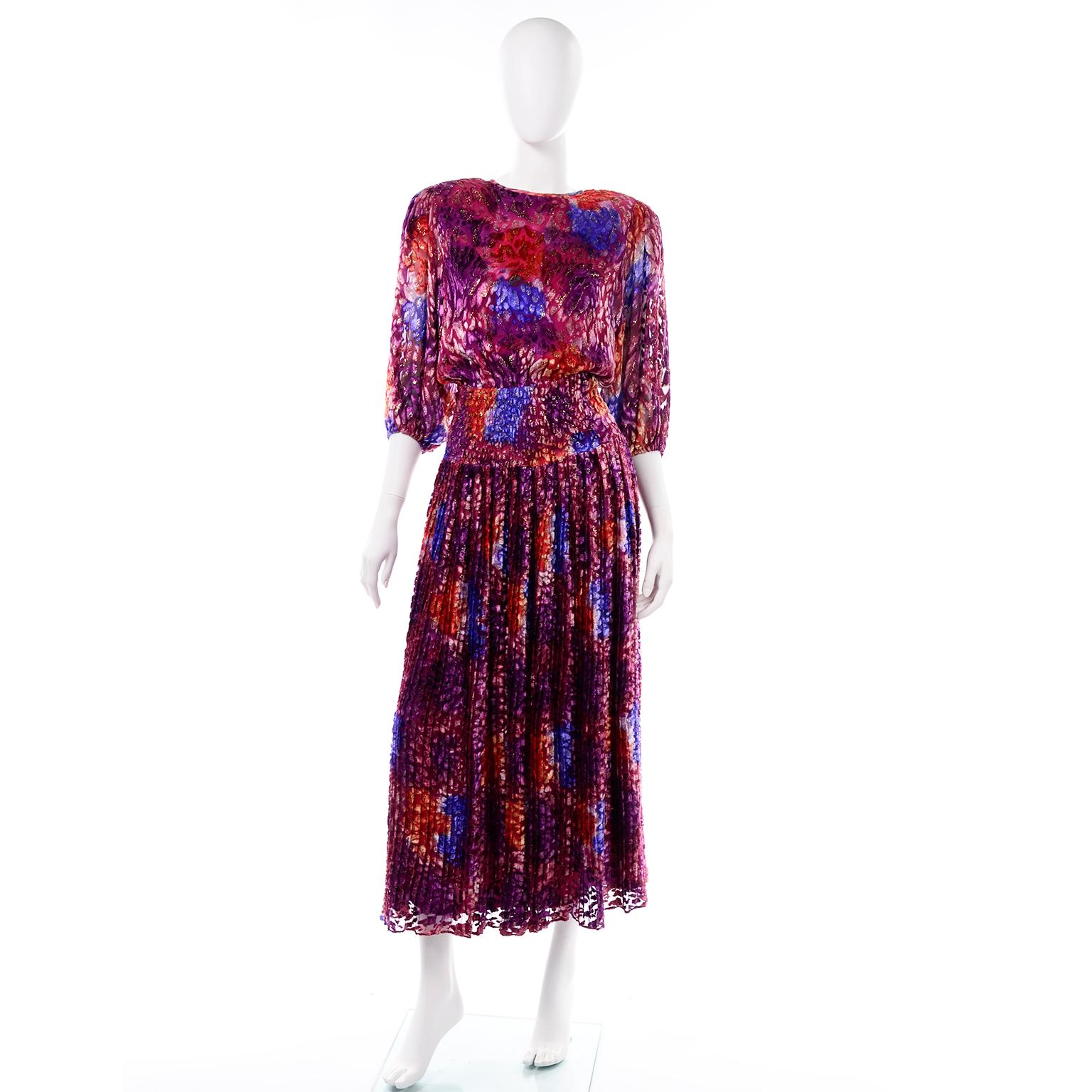 We are obsessed with this vintage Diane Freis Silk Dress! We adore the fabric and the open lattice work in the back! This gorgeous dress is 100% Silk and is made in a burnout velvet abstract watercolor pattern fabric with metallic accents.  The