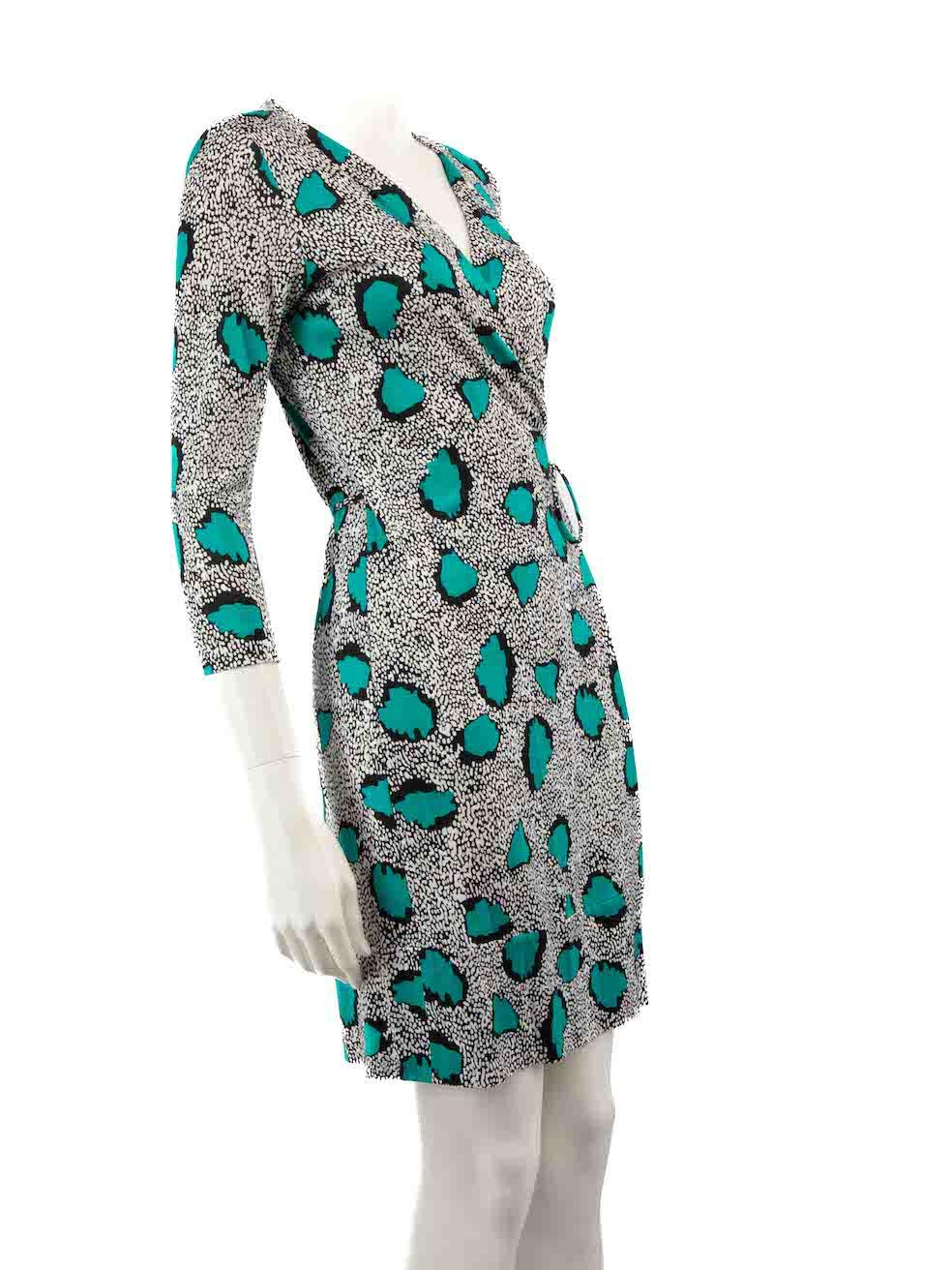CONDITION is Very good. Hardly any visible wear to dress is evident on this used Diane Von Furstenberg designer resale item.
 
 
 
 Details
 
 
 Multicolour- black, white, green
 
 Silk
 
 Wrap dress
 
 Long sleeves
 
 Mini
 
 V-neck
 
 Tie