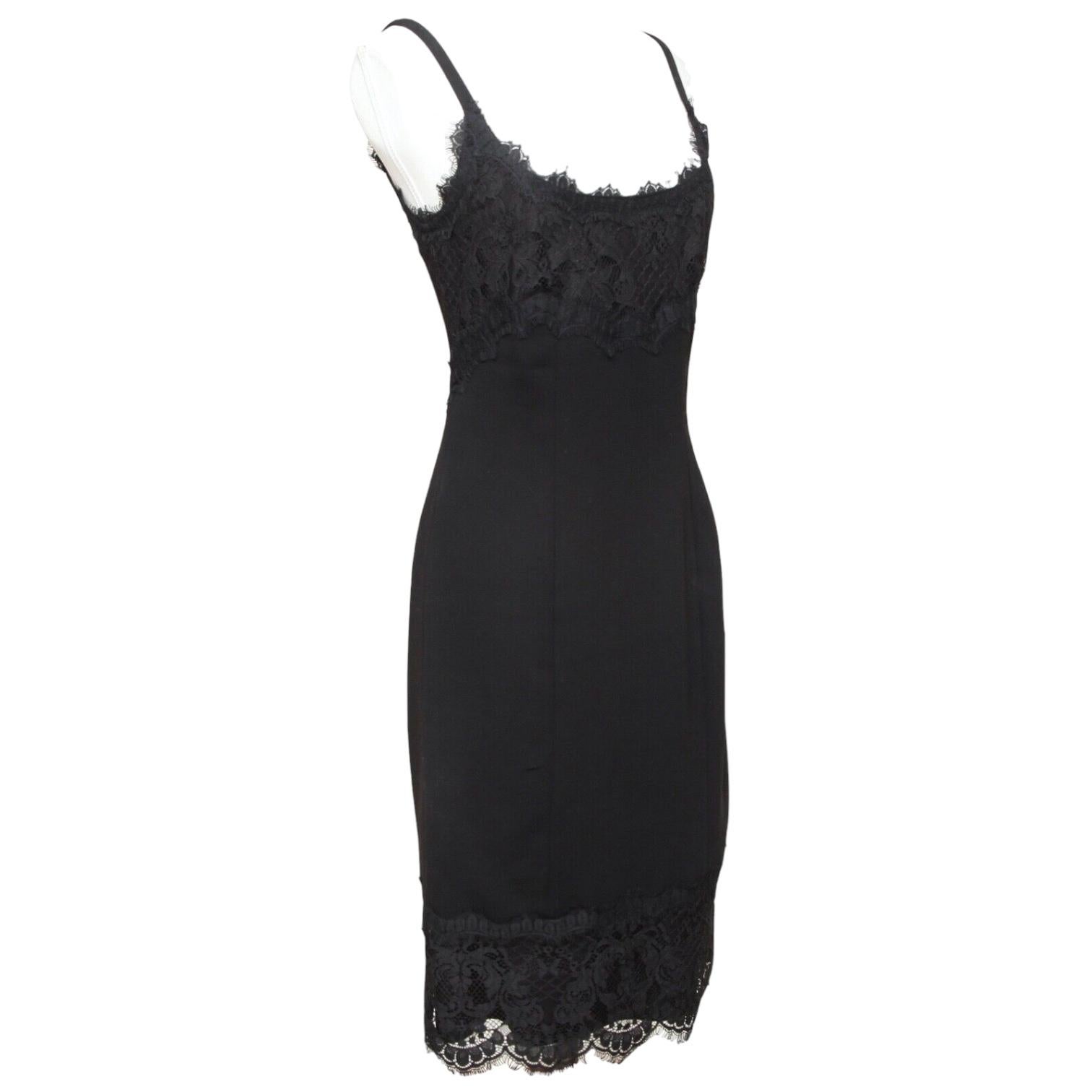 GUARANTEED AUTHENTIC DIANE VON FURSTENBERG BLACK LACE SPAGHETTI STRAP DRESS

Design:
- Slip dress in black.
- Lace trim around neckline and hem.
- Spaghetti straps.
- Back slightly lower than front.
- Side zipper closure.

Material: 70% Triacetate,