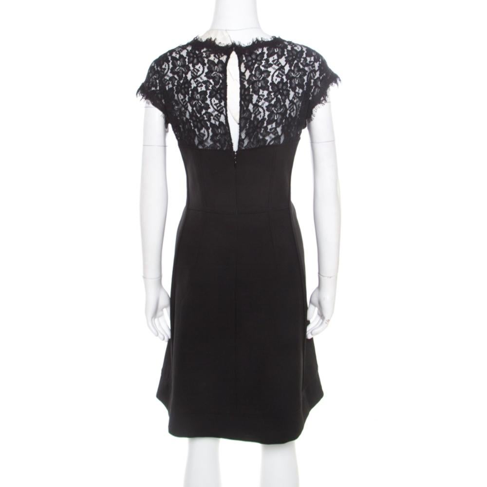 Crafted from a blend of fabrics, this Maddie dress by Diane Von Furstenberg is a show stealer. It has lace short sleeves and intricate lace detailing at the rear bodice. It comes equipped with rear zip closure. Beautifully black, team yours with