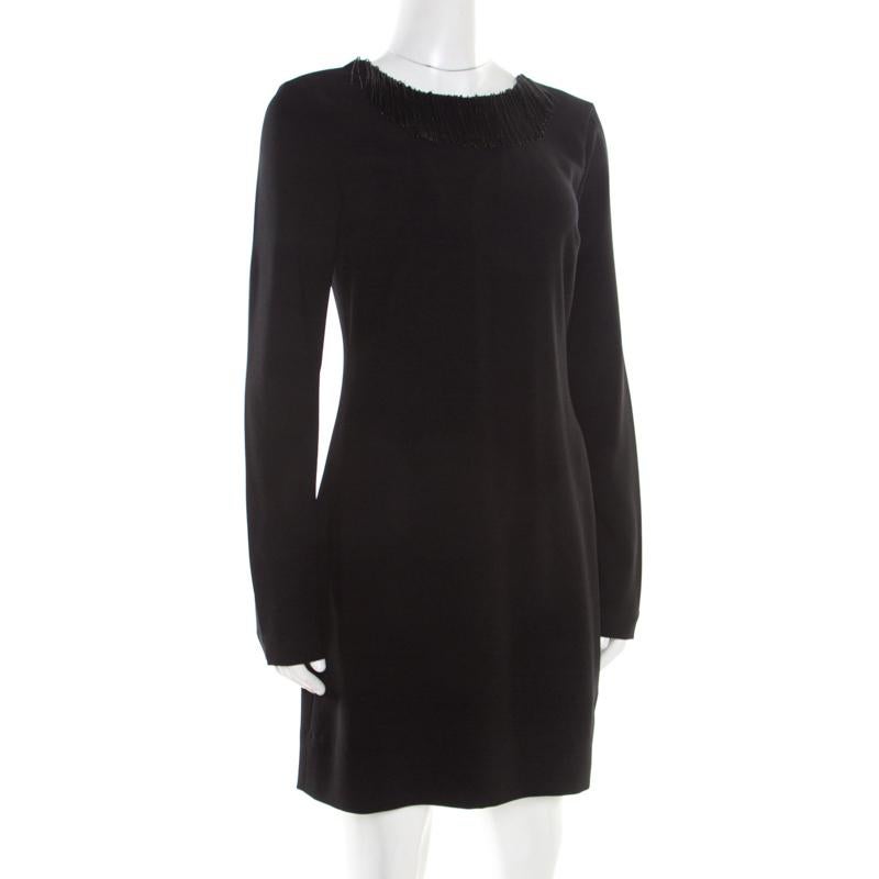 Simple and beautiful, this Diane Von Furstenberg dress is a true example of the brand's refined designs. If you want to keep it basic yet high-end, choose this trendy black dress. Finely tailored, the dress has a lace patch at the back surrounded by