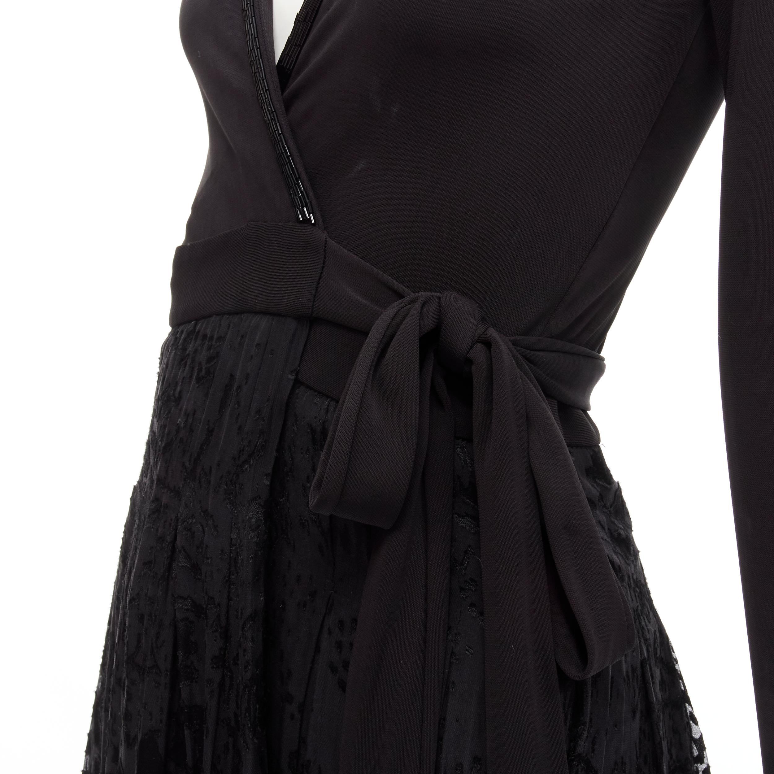 DIANE VON FURSTENBERG black silk bead embellished wrap maxi dress US0 XS 
Reference: JACG/A00033 
Brand: Diane Von Fusternberg 
Designer: Diane Von Fusternberg 
Material: Silk 
Color: Black 
Pattern: Solid 
Closure: Tie 
Extra Detail: Bead