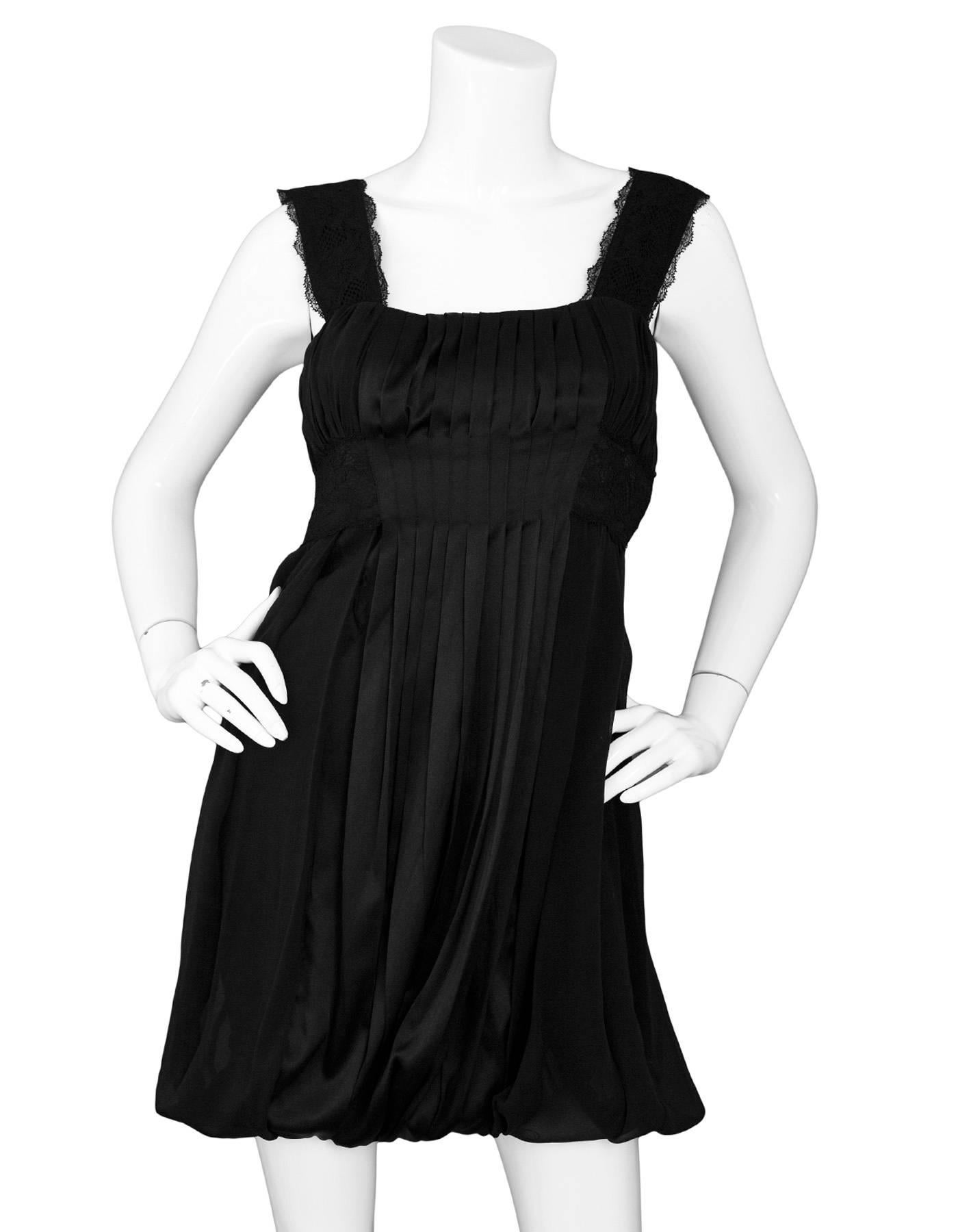 Diane von Furstenberg Black Silk Pleated Dress Sz 4

Features lace trim and bubble hem

Made In: China
Color: Black
Composition: 100% Silk
Lining: Side zip closure
Closure/Opening: Side zip closure - missing zipper pull
Overall Condition: Very good