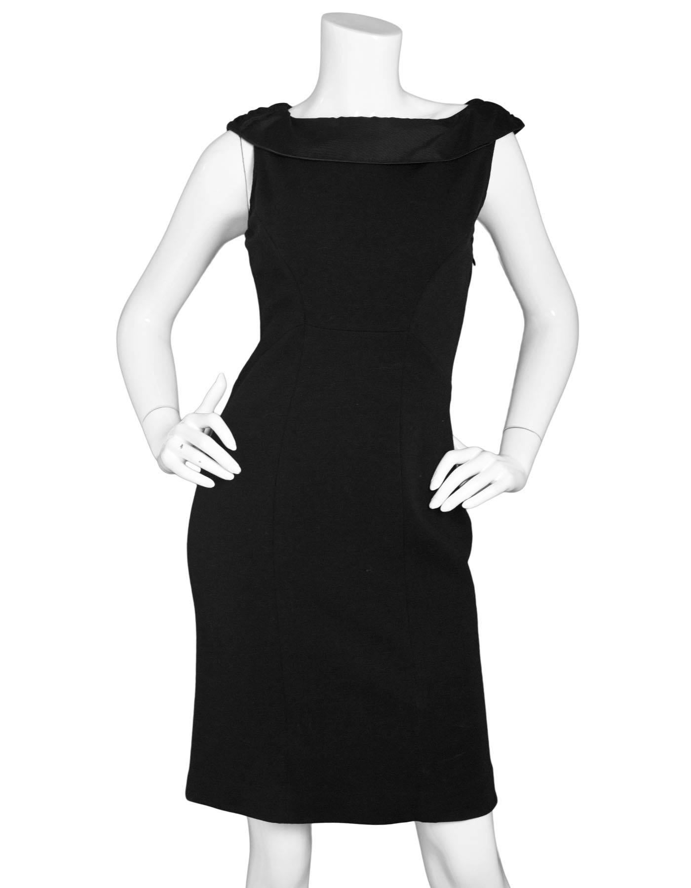 Diane von Furstenberg Black Wool Dress Sz 6

Made In: China
Color: Black
Composition: 76% wool, 21% nylon, 3% spandex
Lining: None
Closure/Opening: Side zip closure
Exterior Pockets: None
Overall Condition: Excellent pre-owned condition, gentle wear
