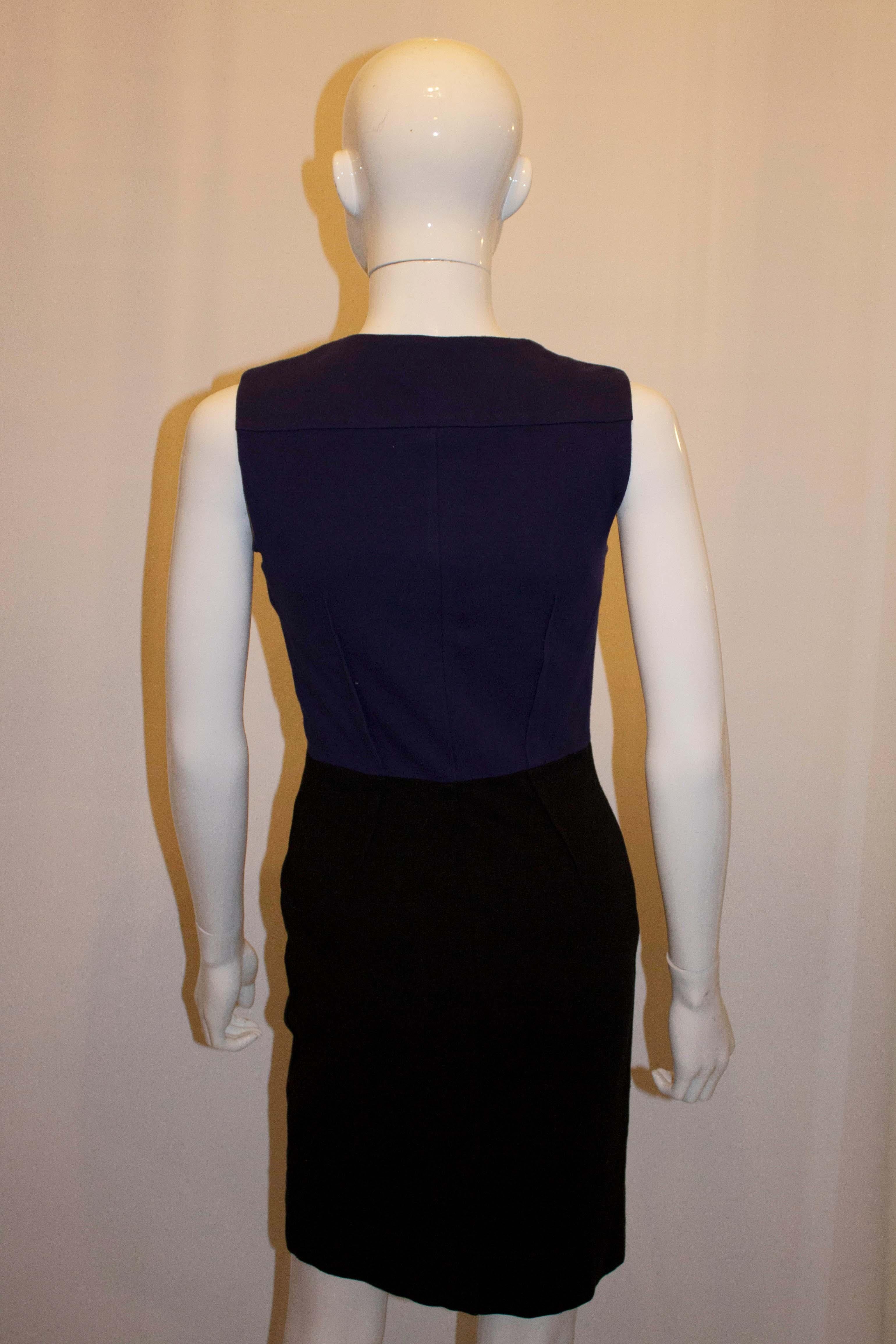 A chic and easy to wear dress by Diane von Furstenberg. The dress has wonderful tailoring, and is in a blue and black colour match with two zips, one going up the other down.
Size 2 , Measurements bust 32'',length 36''
