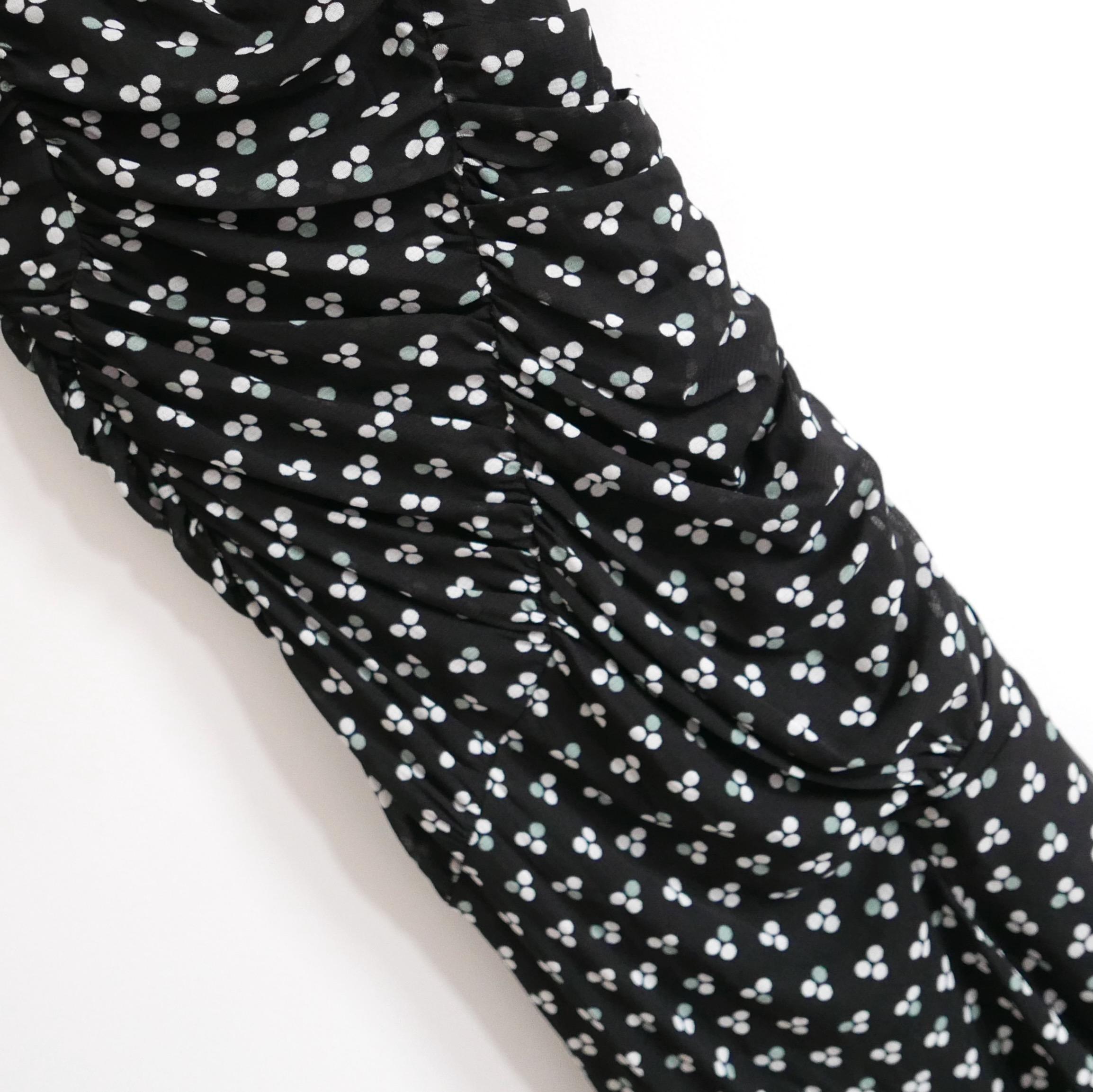 Super chic and versatile Diane Von Furstenberg Briella ruched mesh dress. Bought for £375 and new with tags. Made from super stretchy Triplets Black print nylon mesh with two laters to bodice and 3 to skirt. It has a super flattering, fitted cut