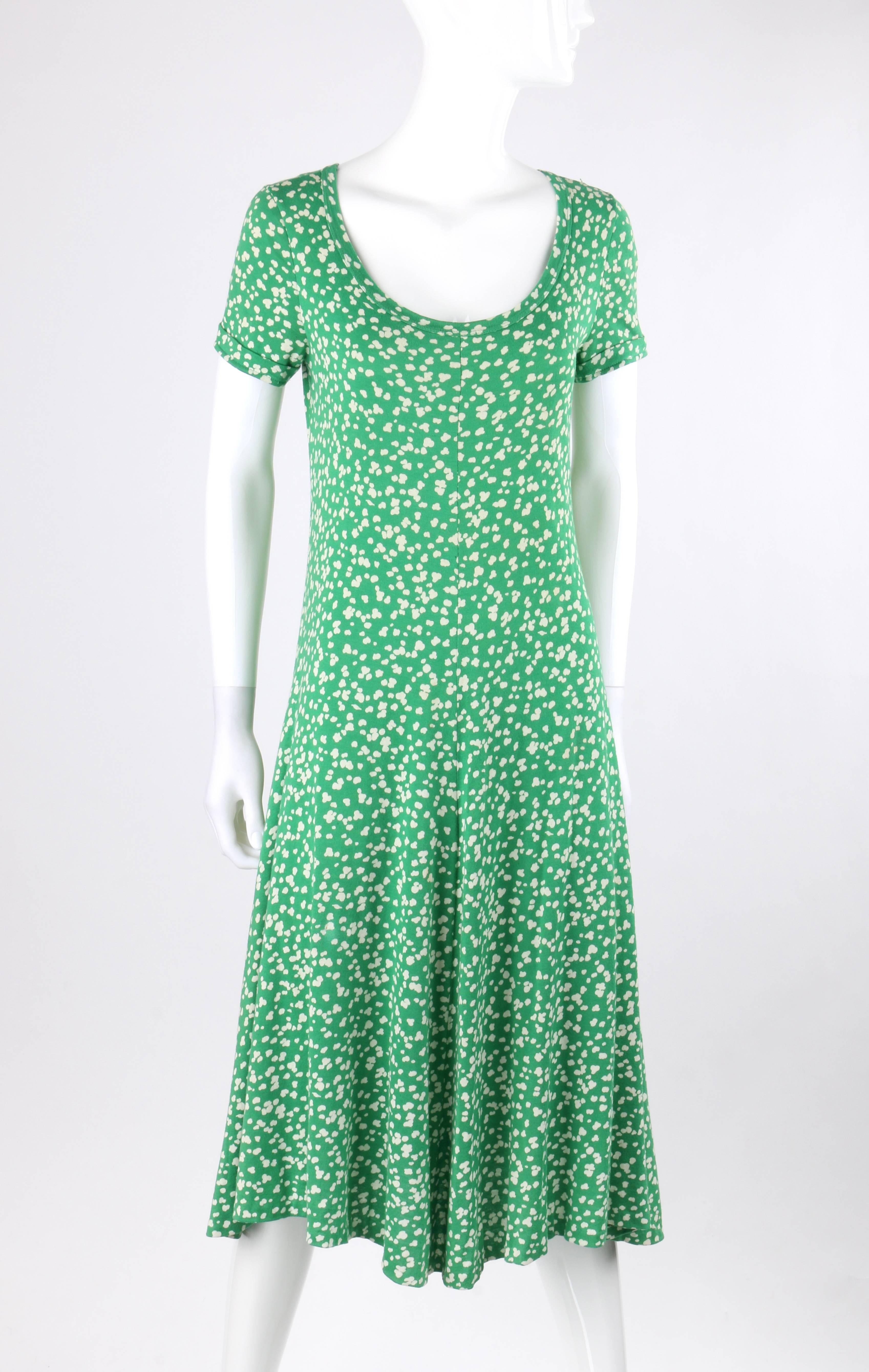 Vintage Diane Von Furstenberg DVF c.1970's green abstract dot print knit shift dress. Off white abstract dot print on kelly green cotton knit. Deep scoop neckline. Short sleeves with turned up cuffs. Bias cut. Slip-on shift style. Unlined. Marked