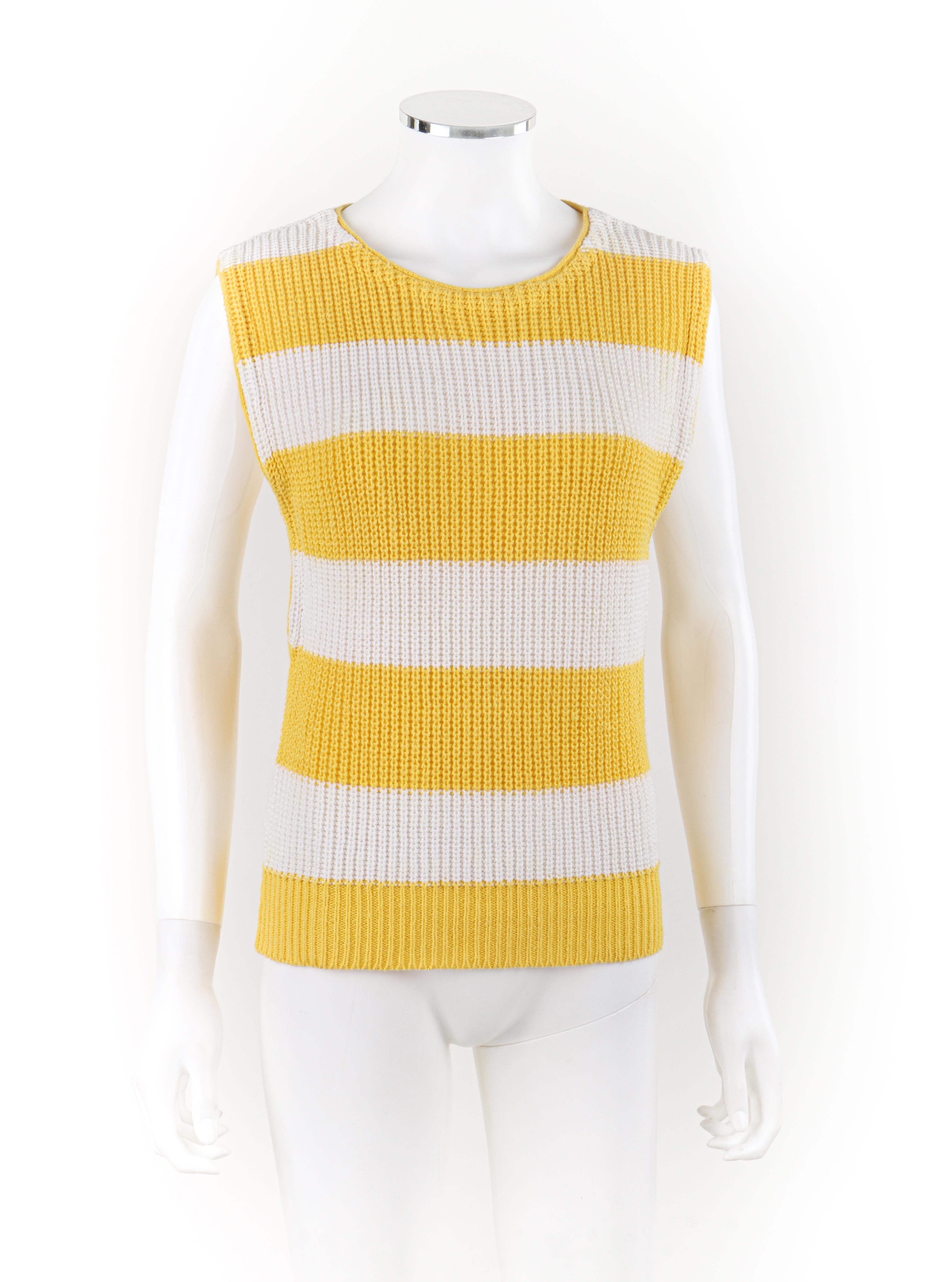 Brand / Manufacturer: Diane Von Furstenberg
Circa: 1980s
Designer: Diane von Furstenberg
Style: Sweater top
Color(s): Shades of yellow, white
Lined: No
Marked Fabric Content: 
