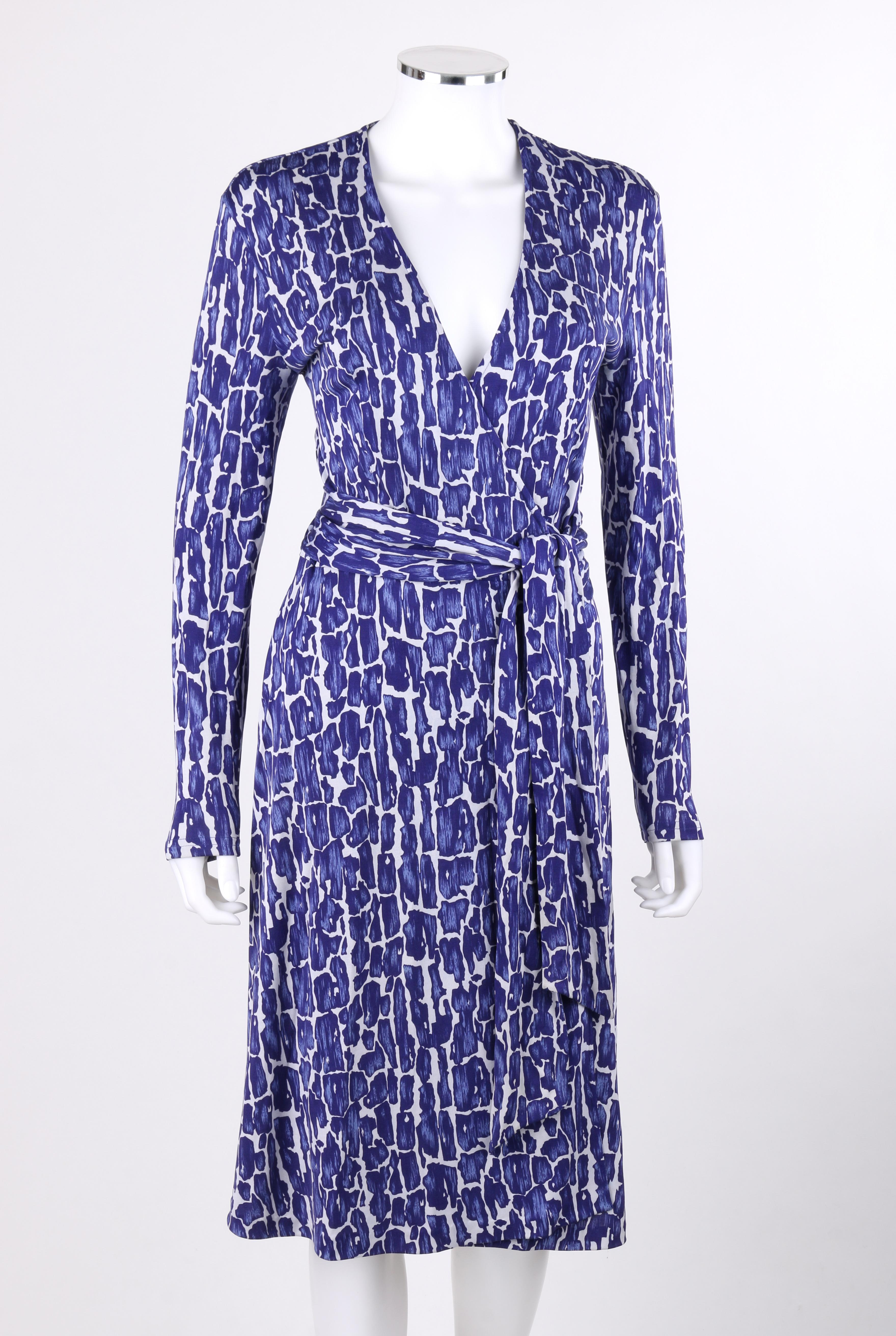 DIANE von FURSTENBERG c.1990's Silk Jersey Abstract Print Blue White Wrap Dress
 
Circa: 1990’s
Label(s): Diane von Furstenberg
Designer: Diane von Furstenberg
Style: Wrap dress
Color(s): Shades of blue and white
Lined: No
Marked Fabric Content: