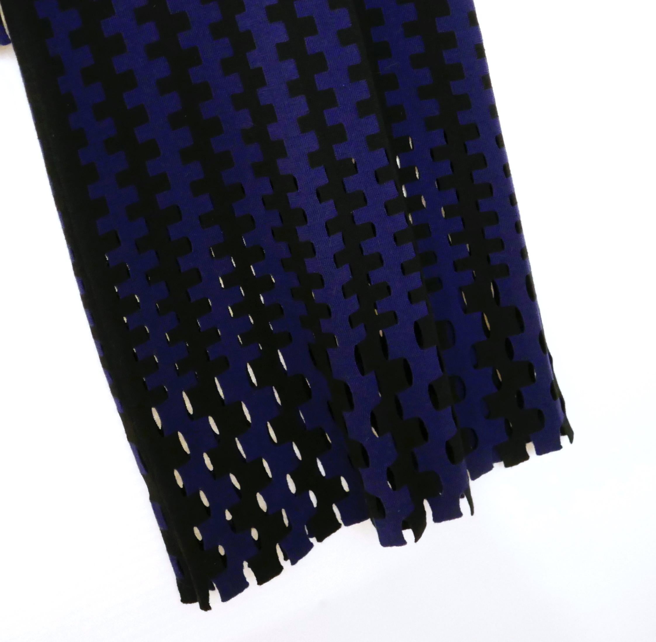 Comfy and slinky knit dress from Diane Von Furstenberg - bought for £495 and unworn.
Made from soft merino wool in a cobalt blue and black hounds-tooth inspired weave, It has
subtly sexy cutout panels to the hem and sleeves and high neck.
Size P