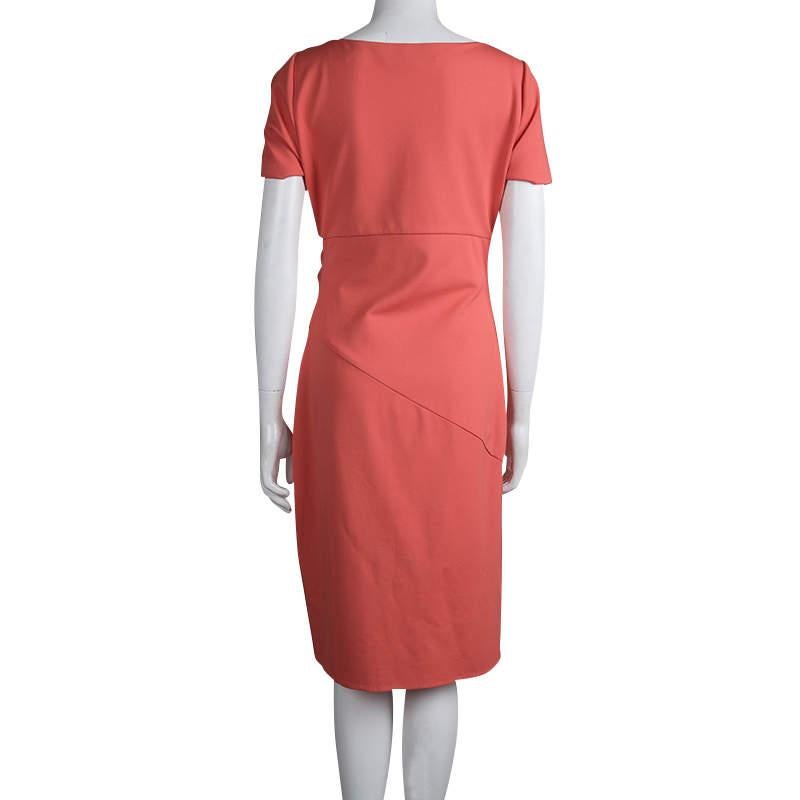 Diane von Furstenberg's 'Bevina' dress is designed in a timeless and flattering silhouette. In a striking coral red hue, it is crafted from stretch-cady with asymmetric panelling and gentle gathers radiating from one side. The pretty scoop neckline