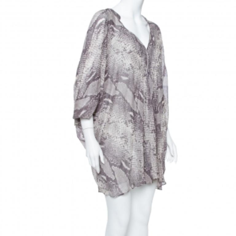 Iconic New York-based designer Diane von Furstenberg is renowned for her super-flattering dresses and bold animal prints. This snakeskin-printed silk style makes a chic option for work or play. Keep the motif in focus with neutral accessories.