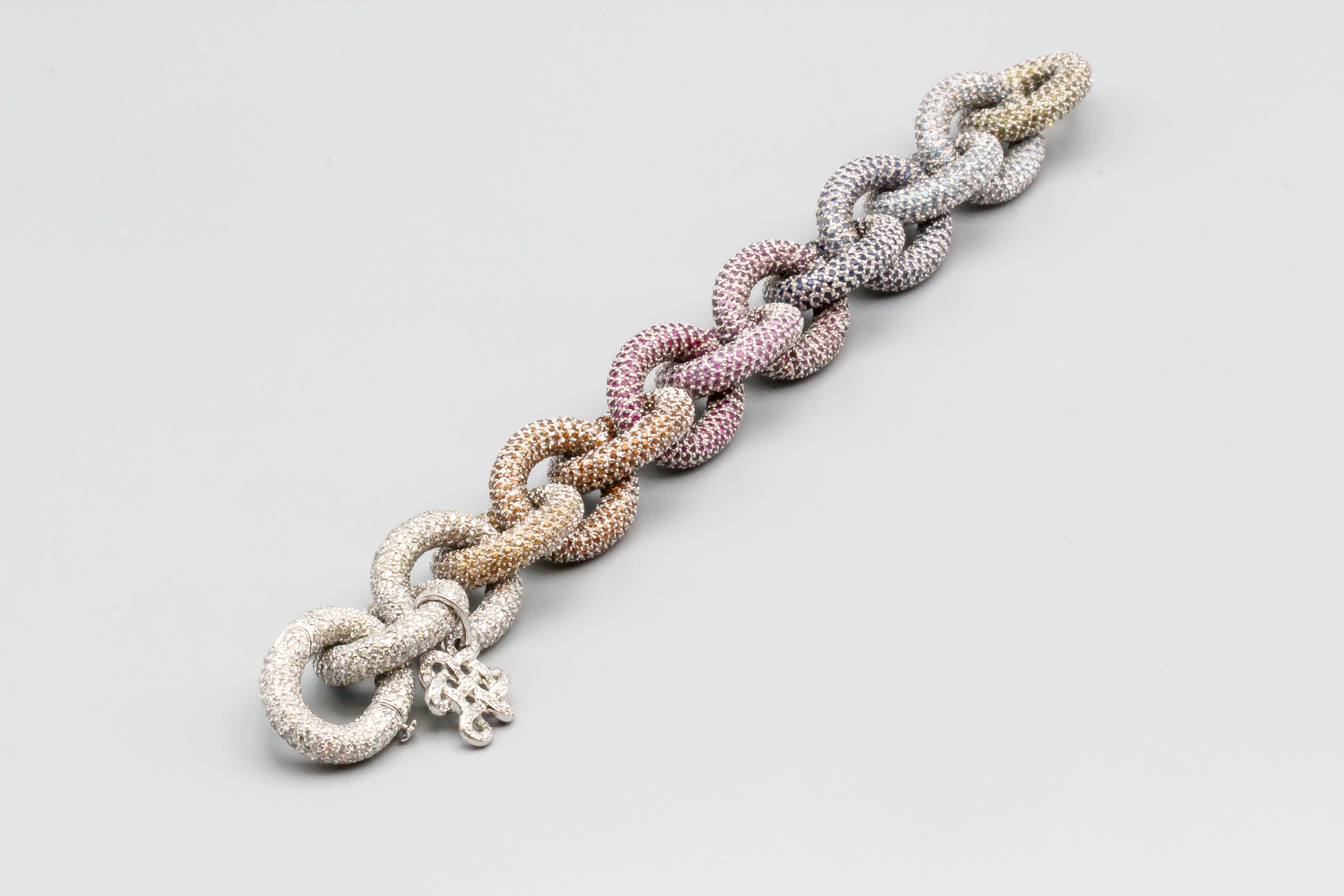 Very fine diamond, colored stone, and 18K white gold link bracelet from the 