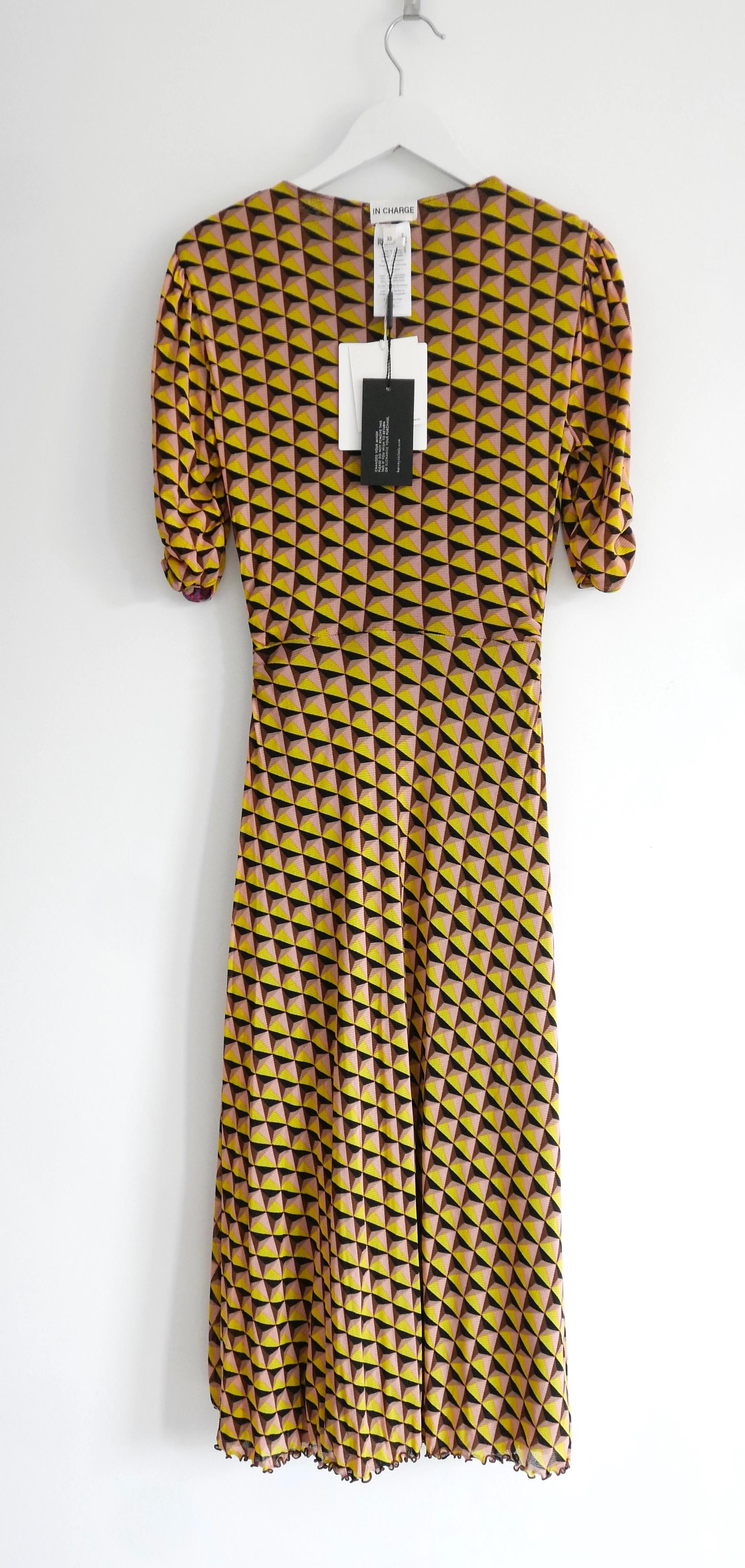 Super chic and versatile Diane Von Furstenberg Koren reversible  dress - bought for £400 and new with tags. Made from super soft, stretchy nylon mesh with geometric print on one side and a floral print on the other. Neck label is supposed to be