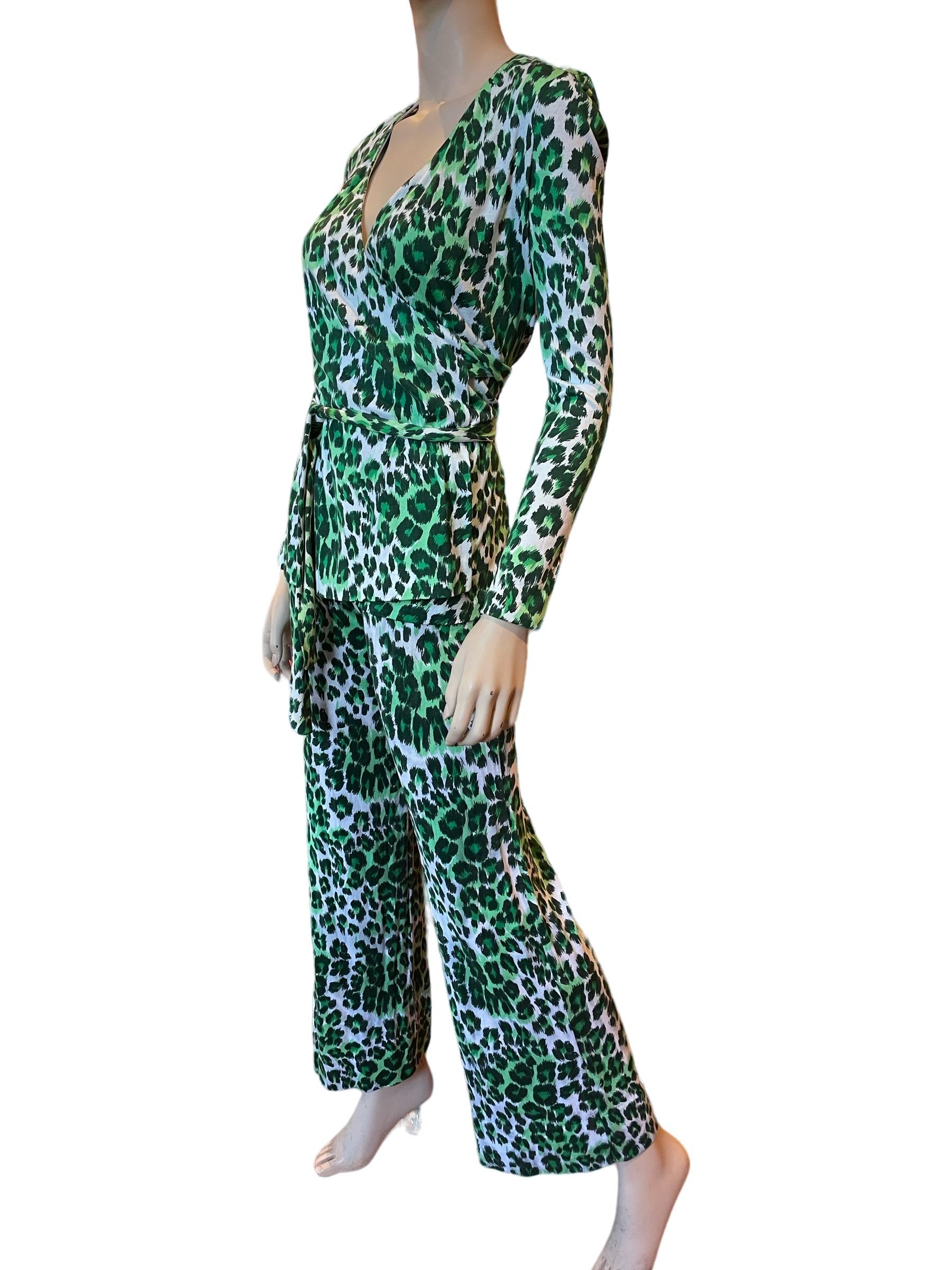 Diane Von Furstenberg late 70s green leopard print wrap blouse and pants 

Elastic Waistband 
Waist: 22-26”
Rise: 13”
Hips: 32-34”

Top:
Bust: 34”
Length: 26”

Slight discoloration on front of pants pictured, however long blouse does cover it 