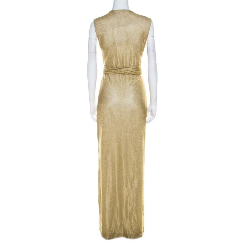 Light up the evenings with glamour in this gorgeous dress from Diane Von Furstenberg. It is a metallic gold knit creation made in a wrap style. The wrap tie details add to the appeal of this sleeveless dress.

Includes: The Luxury Closet Packaging

