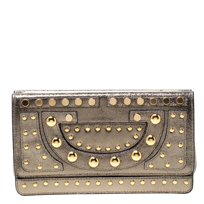 This clutch by Diane von Furstenberg is what you would want to carry on an evening out. The leather exterior is designed with studs and the frame top leads way to a fabric interior which will easily hold your little essentials.

Includes: The Luxury