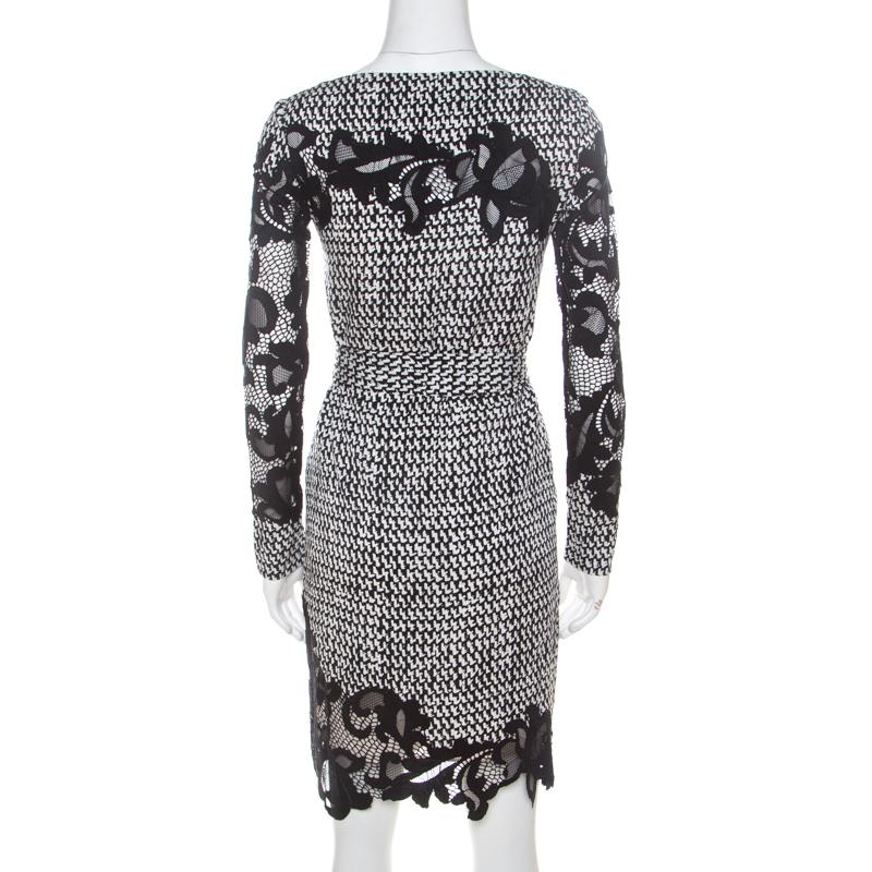 Make a remarkable style statement with this delightful dress from the house of Diane von Furstenberg. Style this monochrome piece with suitable accessories for the ideal look. Dainty and classy, this silk blend outfit is a must-have classic in any
