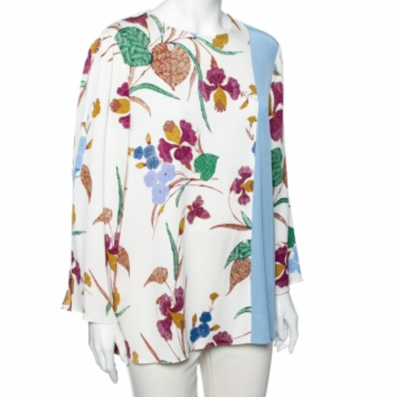 Questo top di Diane von Furstenberg sarà il tuo preferito per questa stagione! Realizzato in tessuto di seta multicolore, questo top presenta una stampa floreale, maniche lunghe e chiusura con bottoni. Porta la freschezza dell'estate nel tuo stile