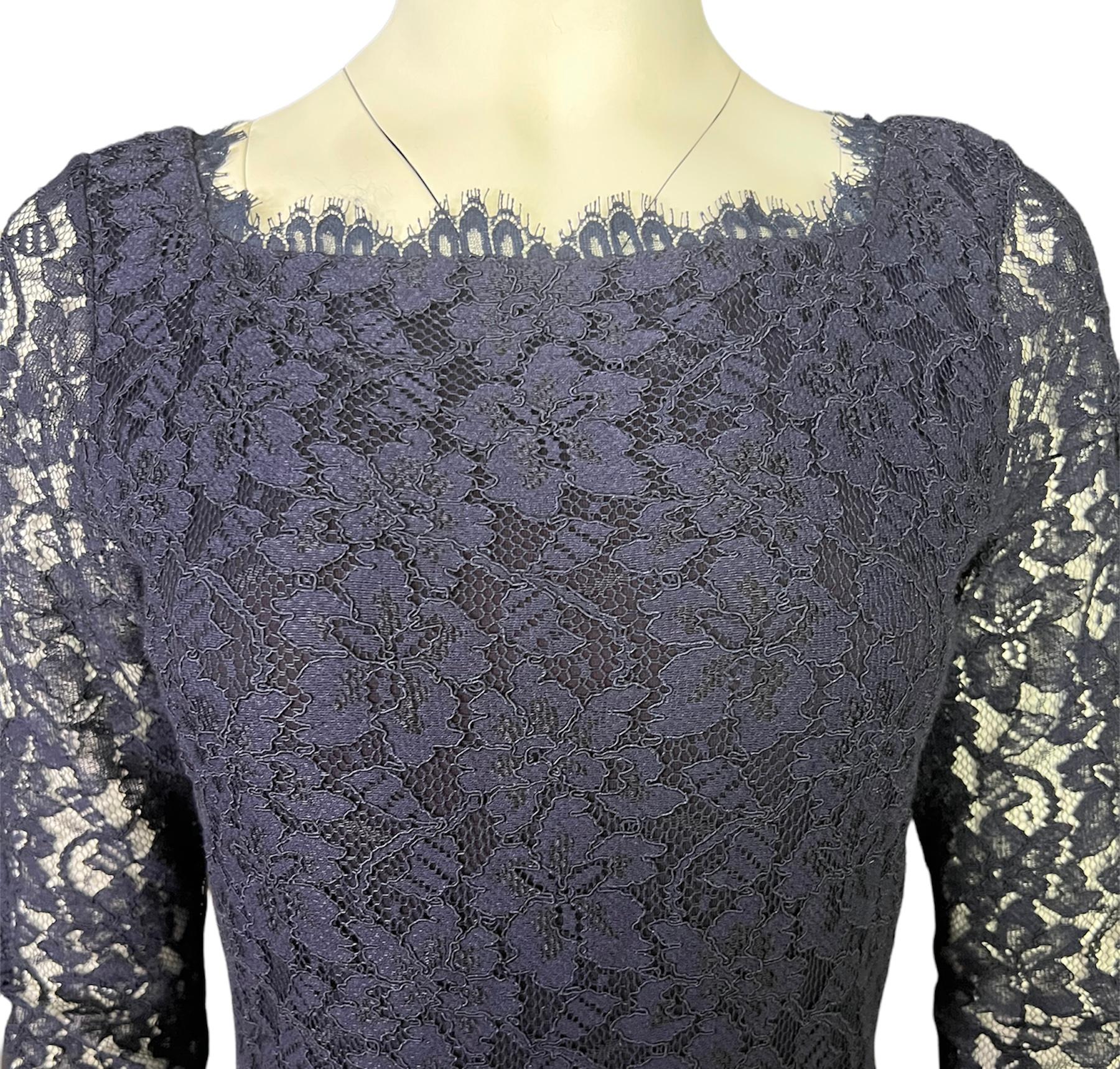 - Floral lace motif
- Gold tone rear zip closure
- 3/4 sleeves length
- Crew neckline on the front and v neckline on the back