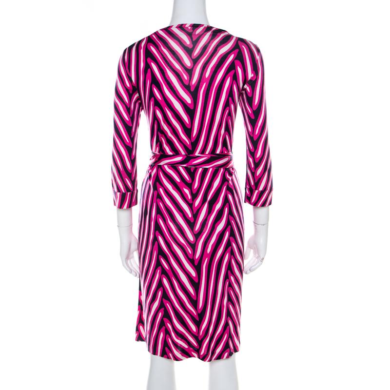 This New Julian wrap dress from Diane von Furstenberg is a versatile piece that you can flaunt on any occasion. The pink and blue dress features a striped pattern all over and carries a waist tie detail, quarter sleeves, and a v-neckline.