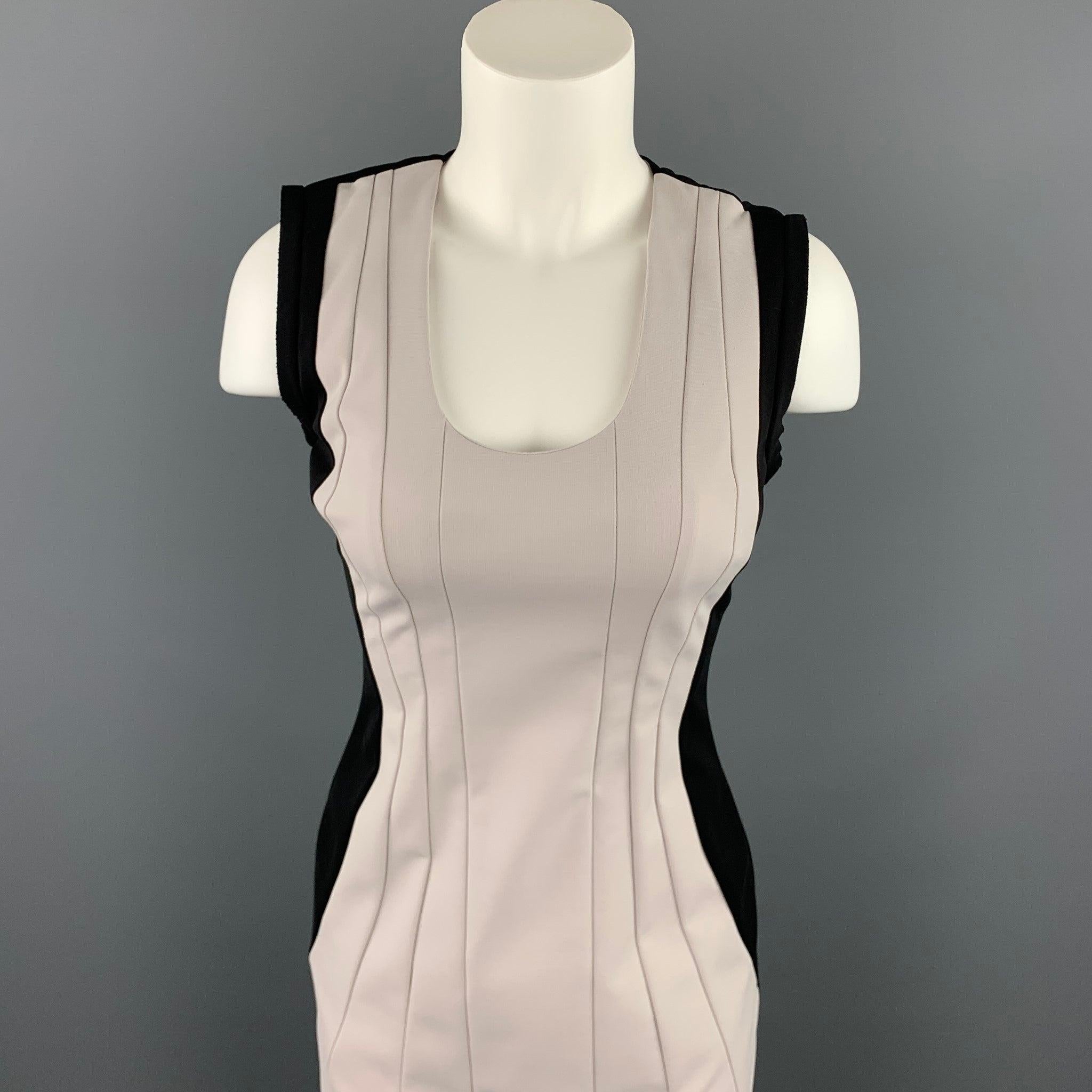 DIANE VON FURSTENBERG dress comes in a cream & black pleated polyamide featuring a sheath style, scoop neck, and a back zip up closure.
Good
Pre-Owned Condition. 

Marked:   2 

Measurements: 
 
Shoulder: 14.5 inches 
Bust: 28 inches 
Waist: 25