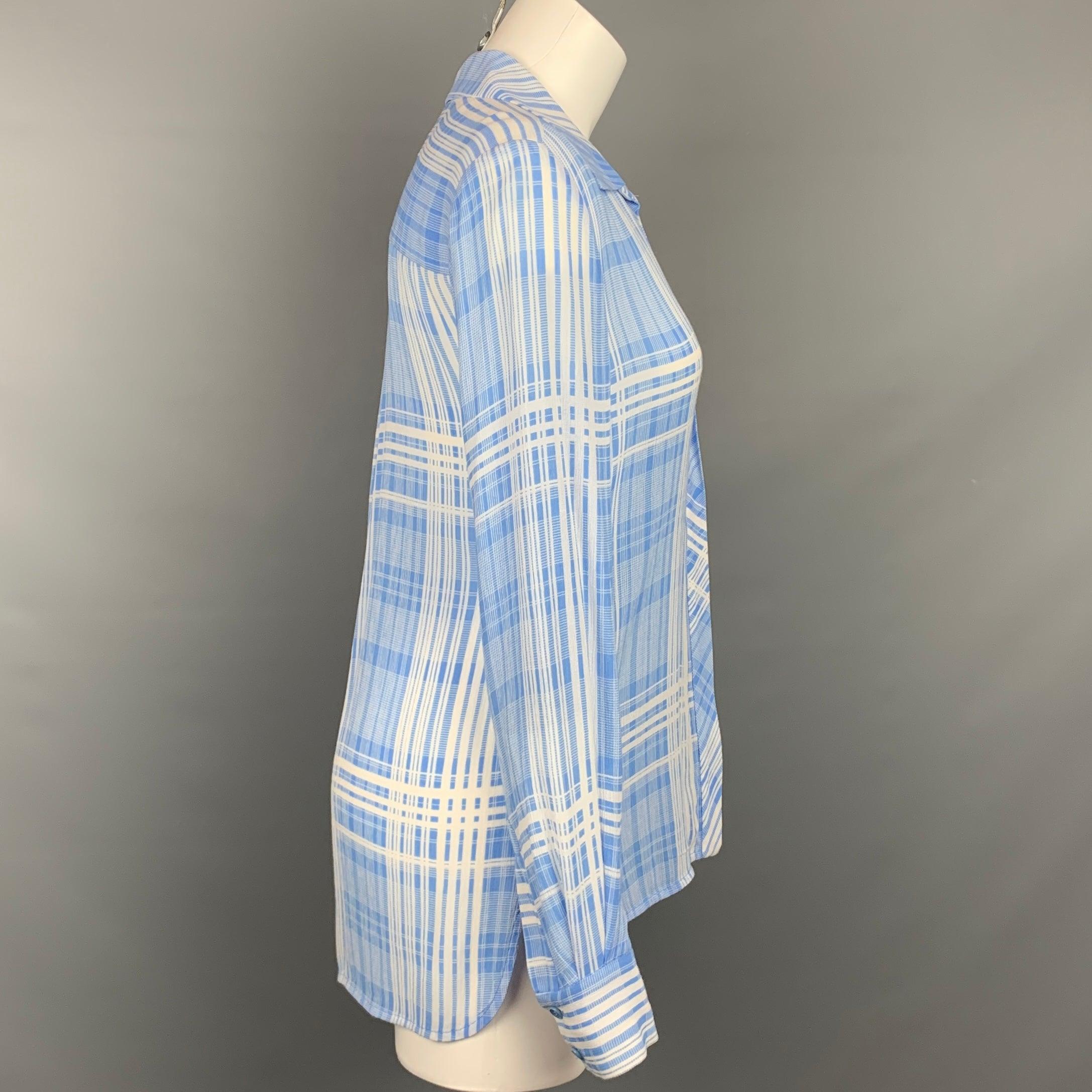 DIANE VON FURSTENBERG blouse comes in a light blue 7 white plaid viscose blend featuring a front pocket, spread collar, loose fit, and a hidden placket closure.
Very Good
Pre-Owned Condition. 

Marked:   2 

Measurements: 
 
Shoulder: 16.5 inches