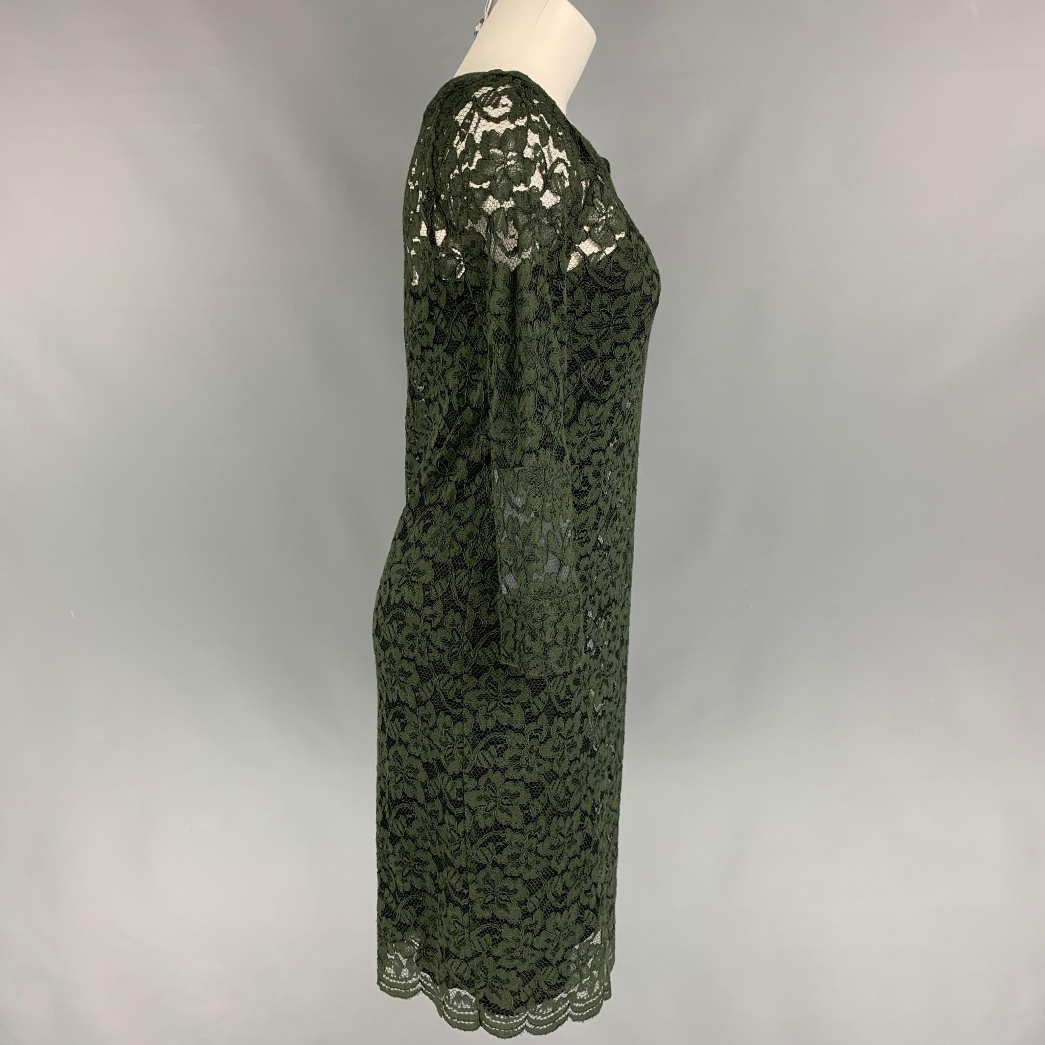 DIANE VON FURSTENBERG dress comes in a a dark green polyamide with a slip liner featuring a wide neckline. long sleeves, and a slip on style. 

Very Good Pre-Owned Condition.
Marked: 4

Measurements:

Shoulder: 17 in.
Bust: 32 in.
Hip: 34