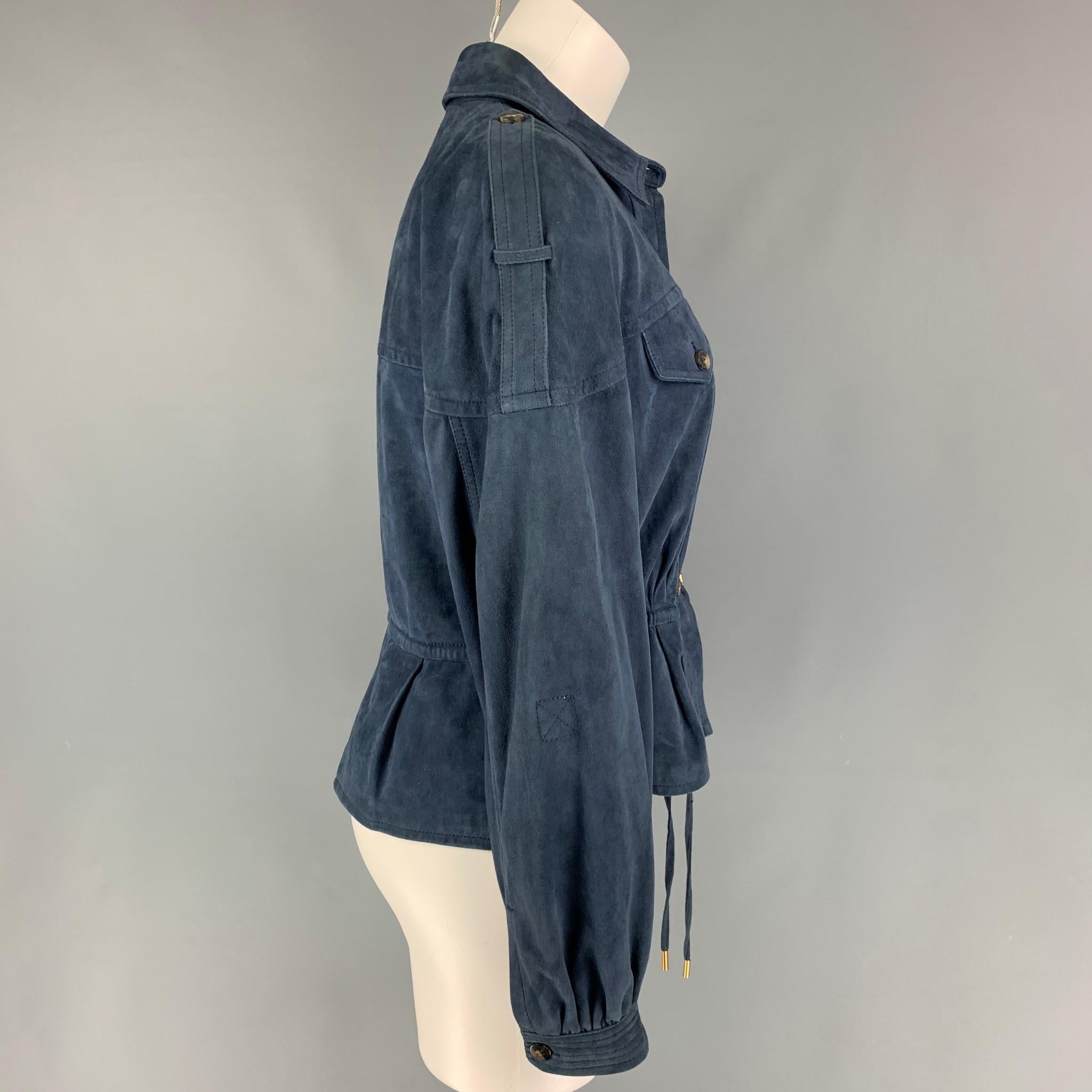 DIANE VON FURSTENBERG jacket comes in a blue suede featuring a drawstring waist detail, epaulettes, front pockets, and a buttoned closure. 

Very Good Pre-Owned Condition.
Marked: 6

Measurements:

Shoulder: 23.5 in.
Bust: 36 in.
Sleeve: 19