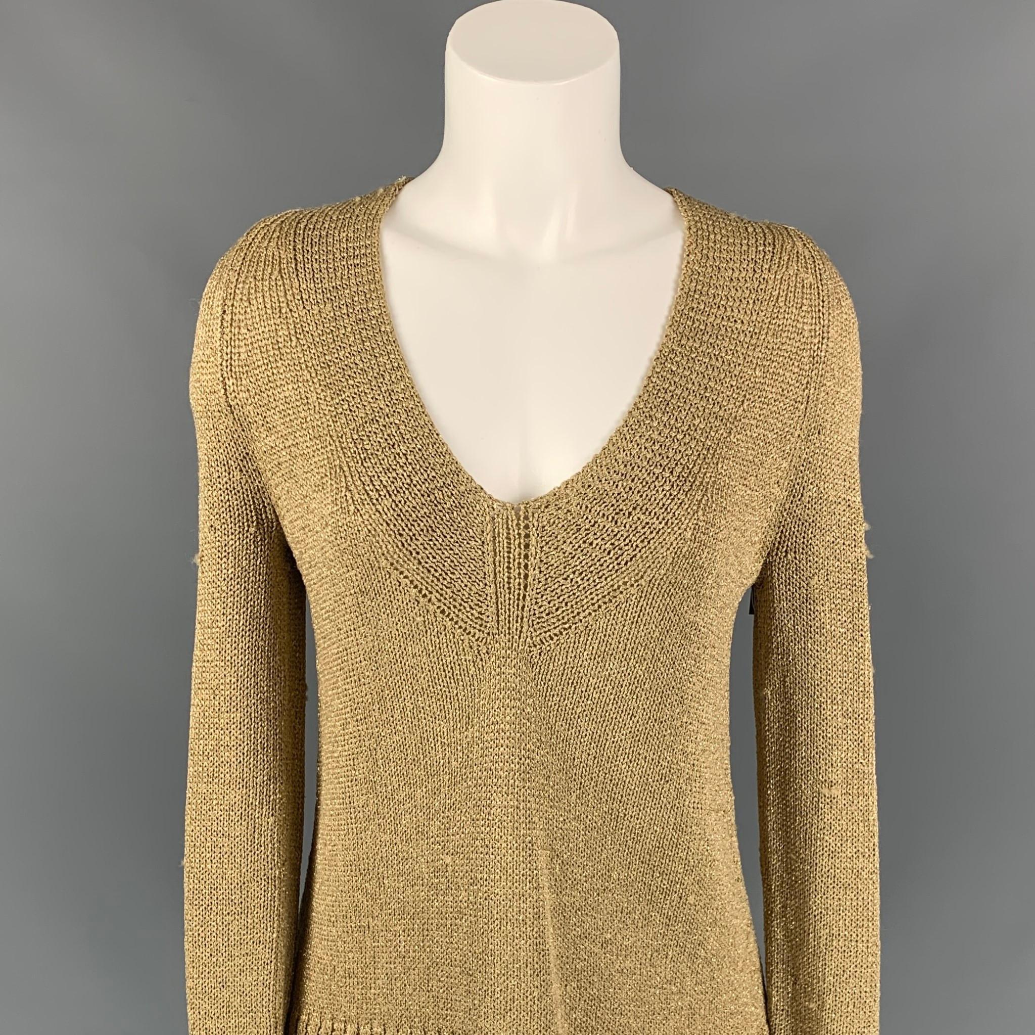 DIANE VON FURSTENBERG pullover comes in a gold knitted acetate blend featuring long sleeves and a deep v-neck. 

New With Tags. 
Marked: P

Measurements:

Shoulder: 17 in.
Bust: 34 in.
Sleeve: 25.5 in.
Length: 27 in. 