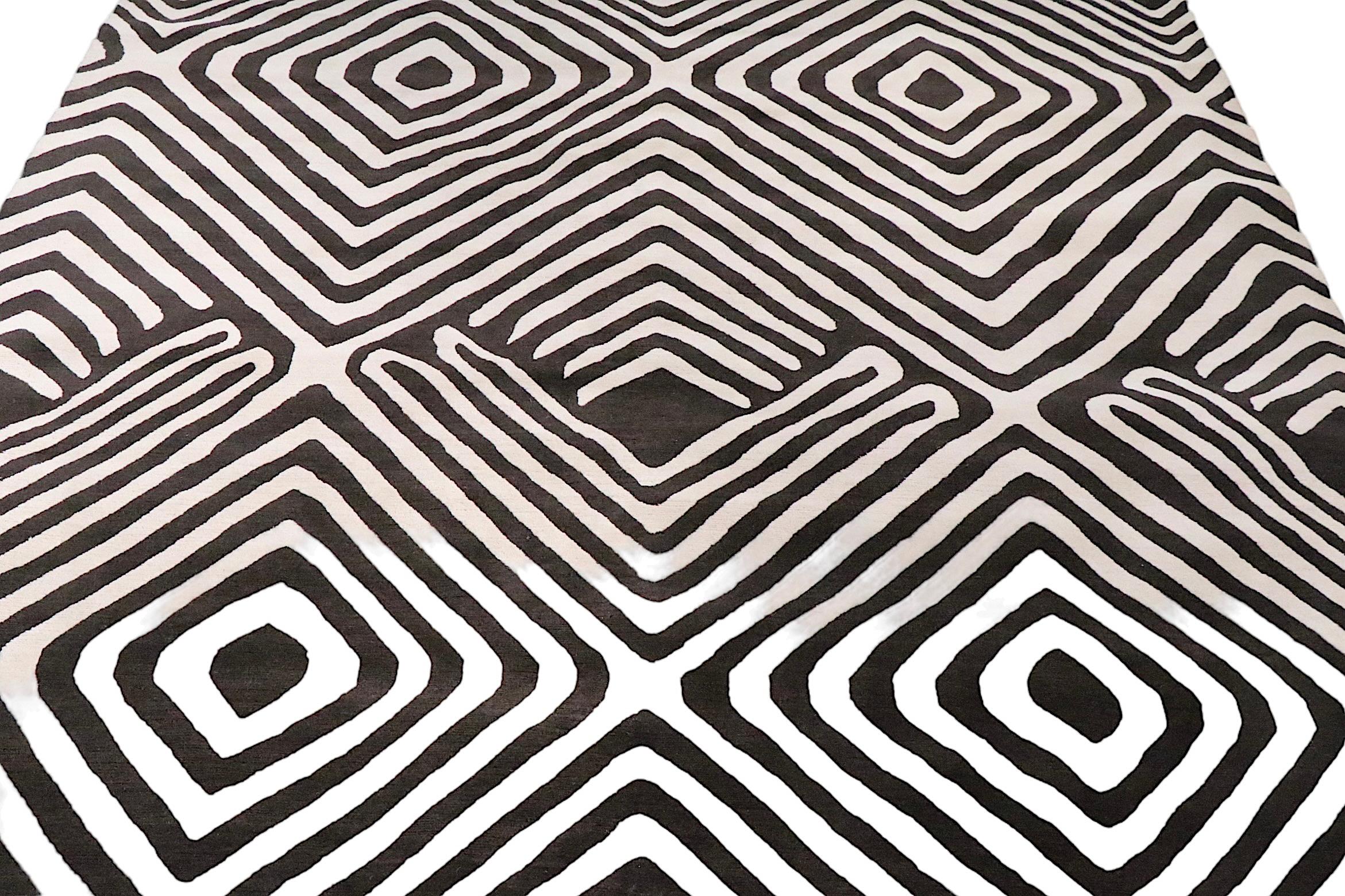 Exceptional Diane Von Furstenberg carpet, in the sought after Tribal Diamond pattern, made in 2019, for The Rug Company. The rug is of hand knotted wood, made in Nepal, executed in dark chocolate, with a taupe ground. The colors are even throughout,